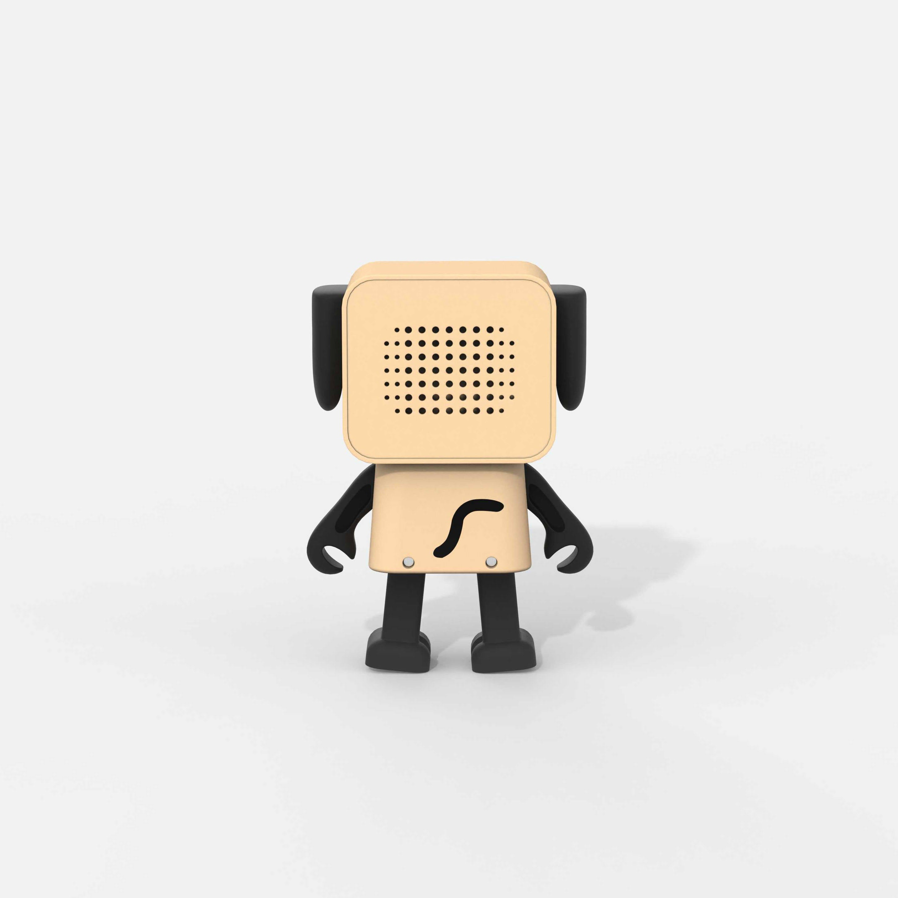 Beżowy głośnik w kształcie psa z czarnymi uszami i nogami, na białym tle.