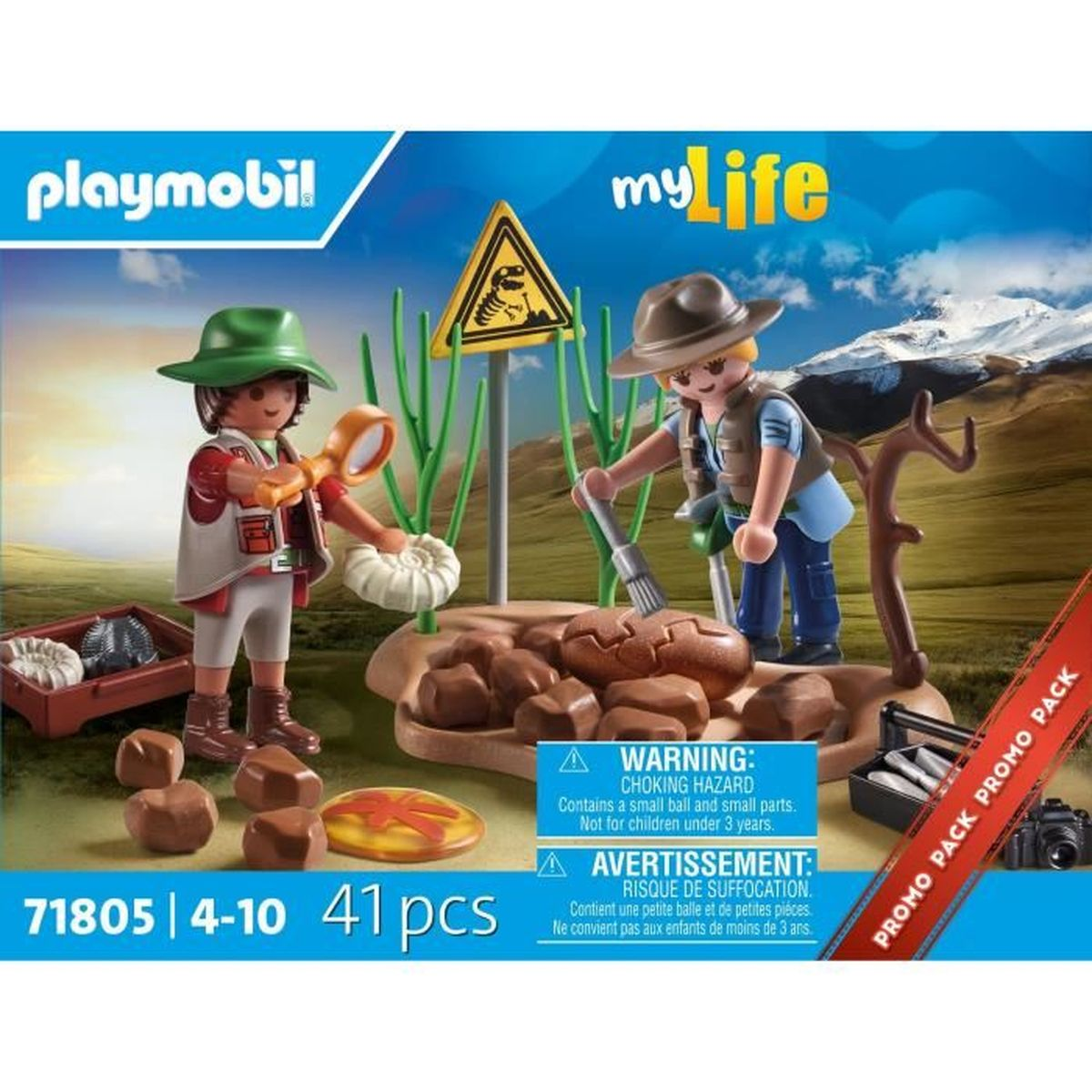 Zestaw Playmobil z dwiema figurkami, lupą i kośćmi dinozaurów na brązowej skale.