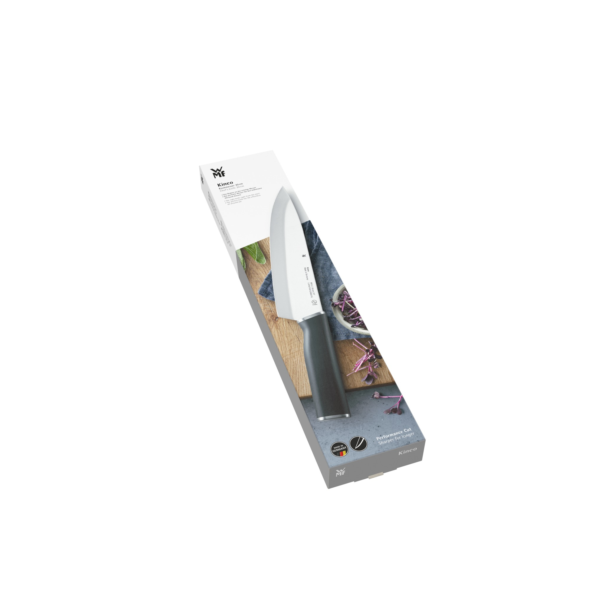 Ein WMF-Küchenmesser in seiner Verpackung. Schwarzer Griff und silberne Klinge.