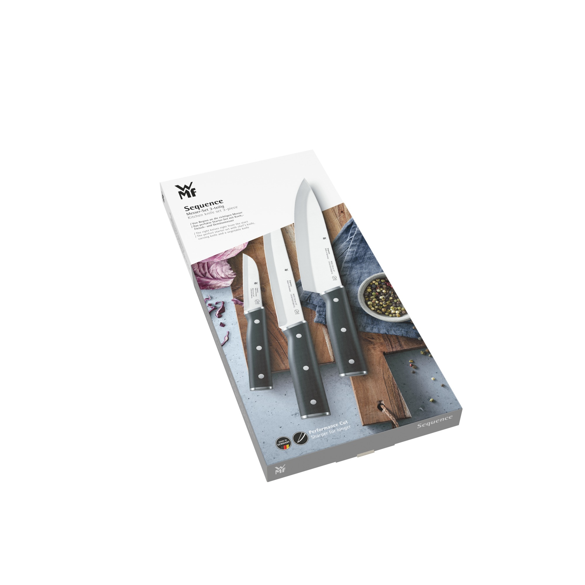 Ein Set von WMF-Messern in der Verpackung. Drei Messer mit schwarzen Griffen.