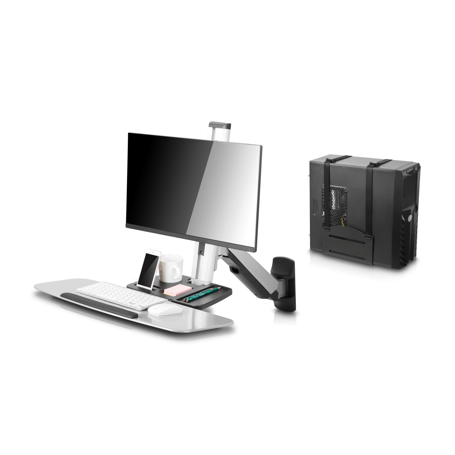 Schreibtisch-Setup mit Monitor, Computer, Tastatur, Telefon und Büromaterial.