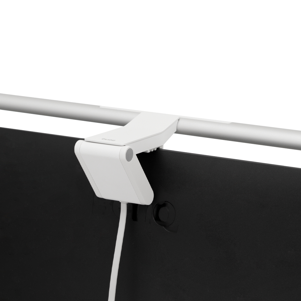 White light bar attached to a black monitor. White background.