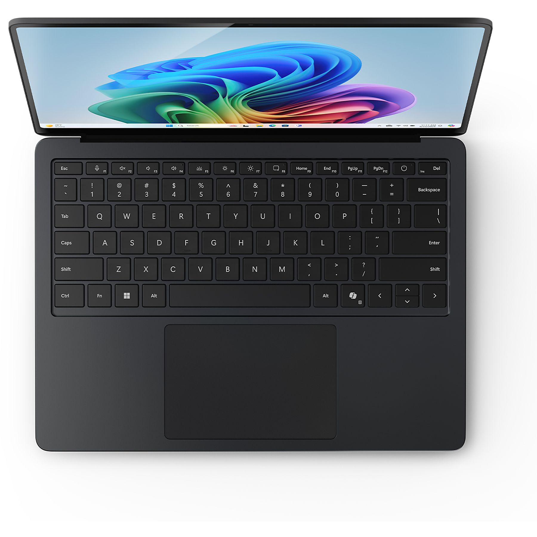 Widok klawiatury czarnego laptopa. Laptop jest otwarty na białym tle.