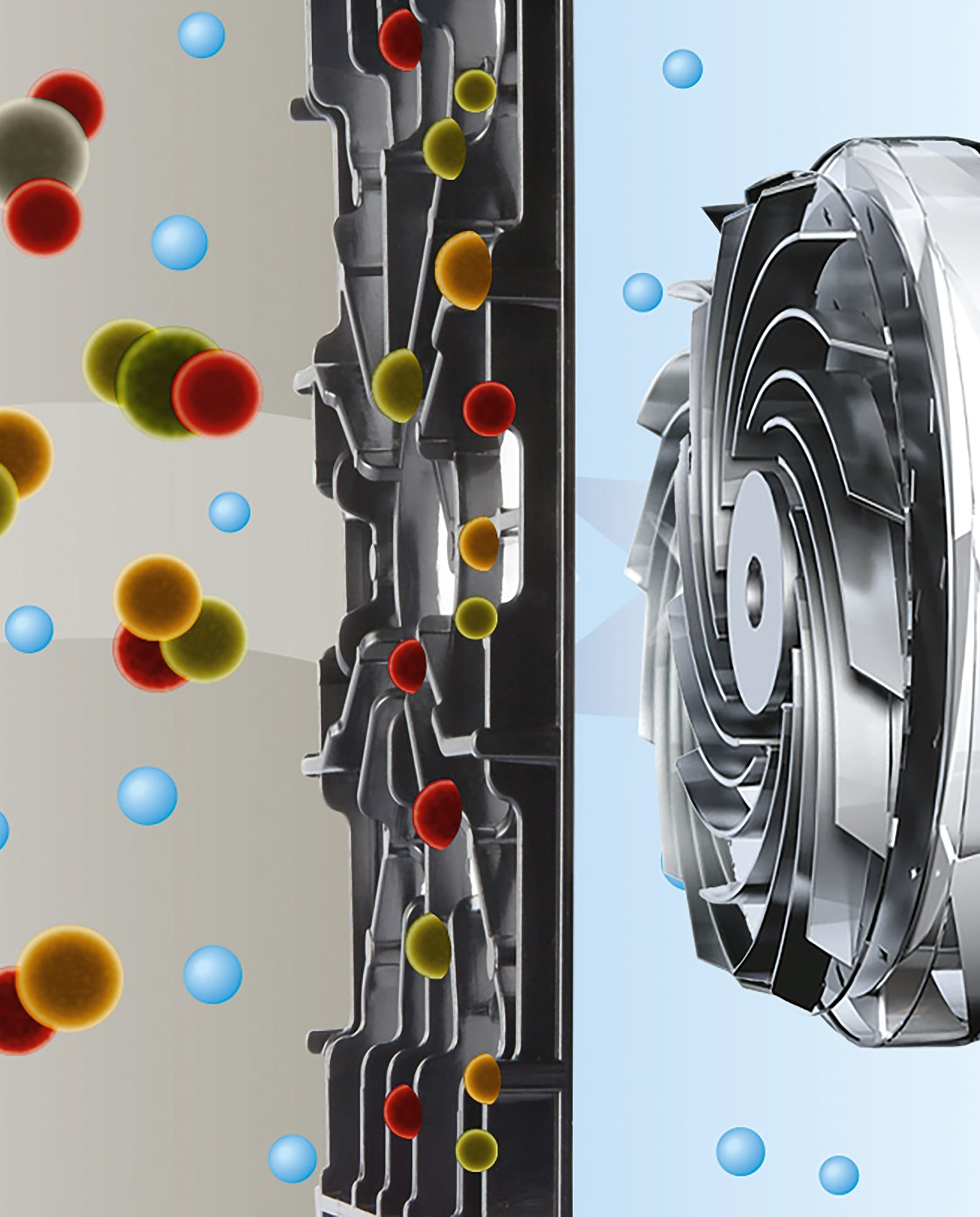 Przekrój urządzenia pokazujący wewnętrzne komponenty z kolorowymi kulami i strukturą przypominającą wentylator.