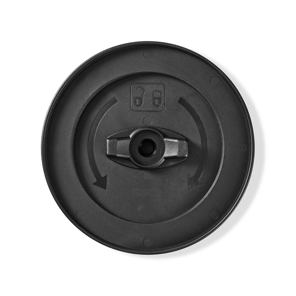 Black plastic disc with a central knob and arrows. The disc has a circular shape and a central hole.