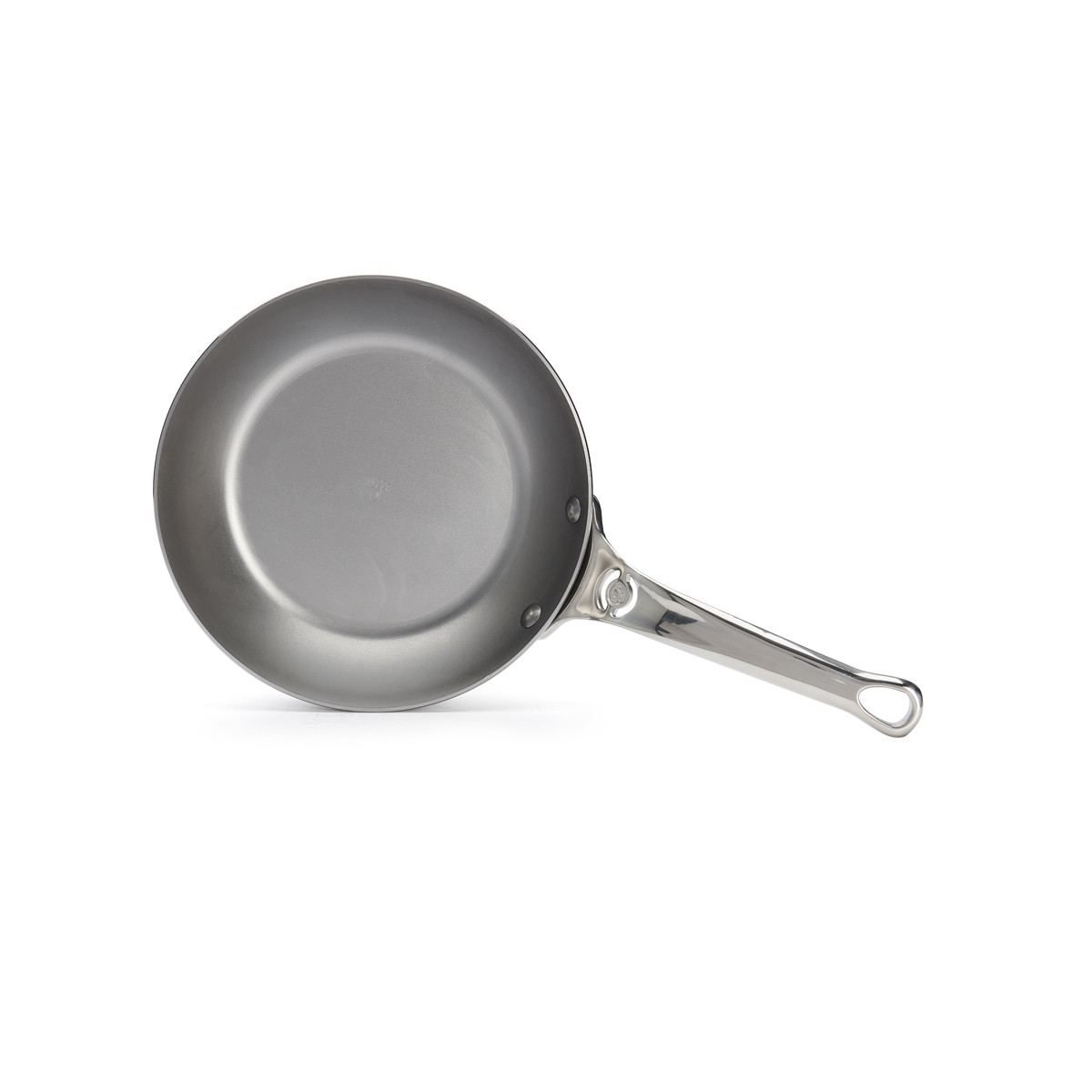 A stainless steel frying pan with a long handle, slightly angled and on a white surface.
