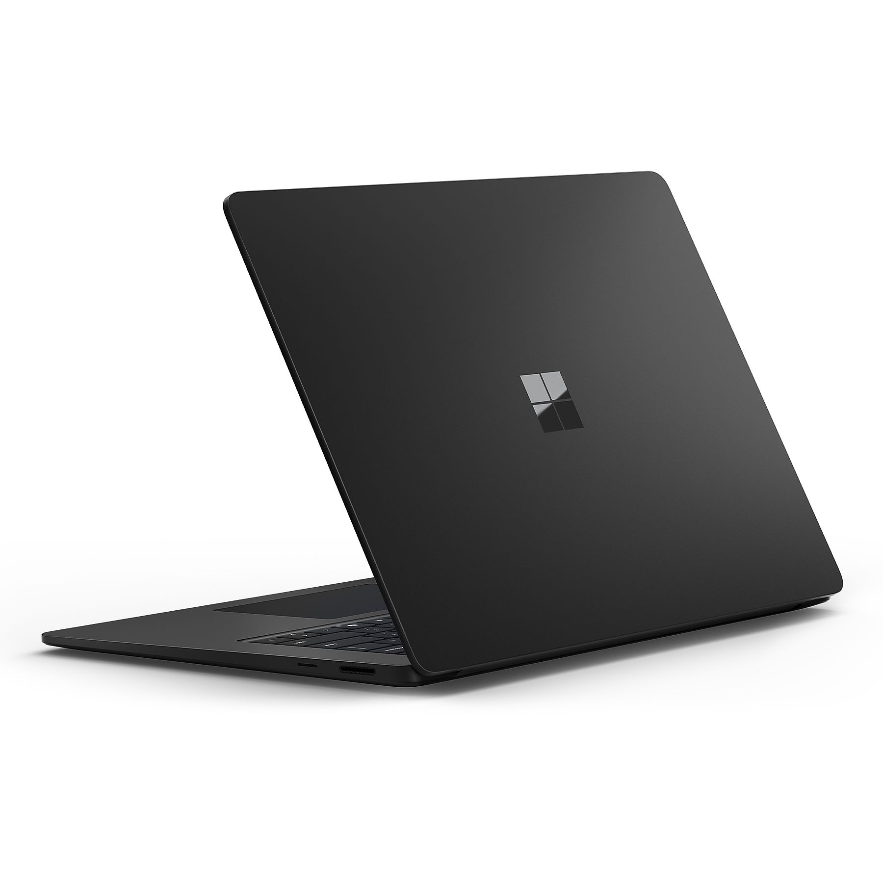 Vista posteriore di un laptop nero con il logo Microsoft sul coperchio, su sfondo bianco.