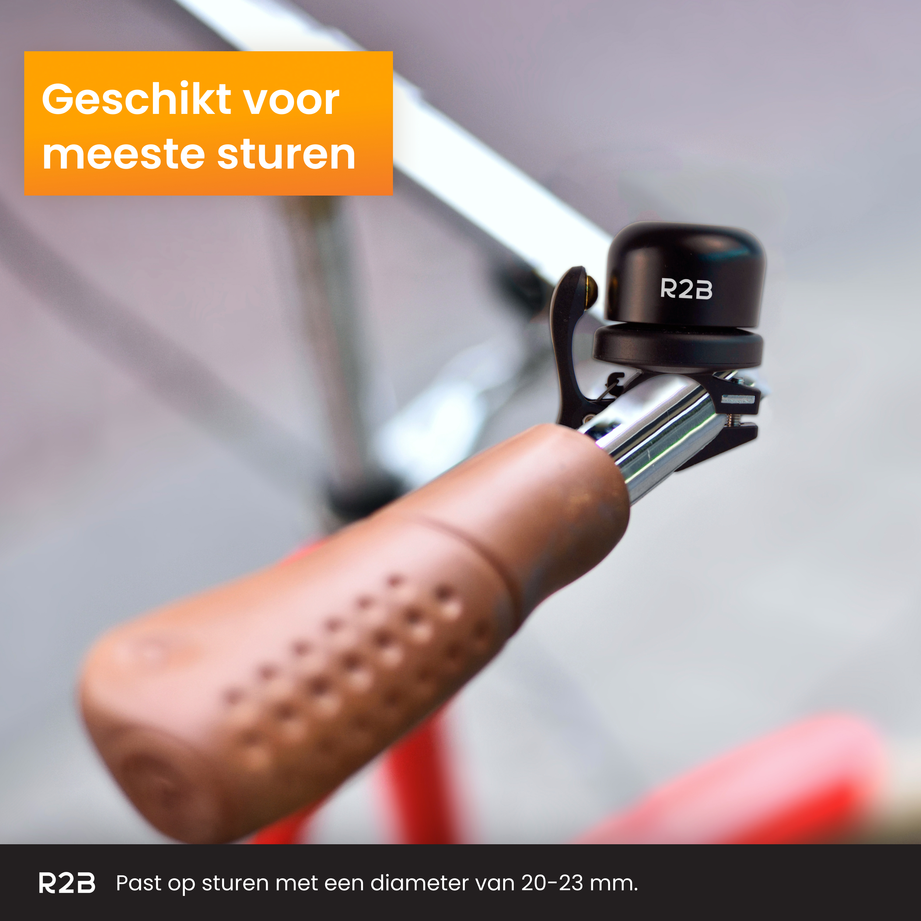 A bicycle handlebar with a brown grip and a black bell with the text 'R2B'.