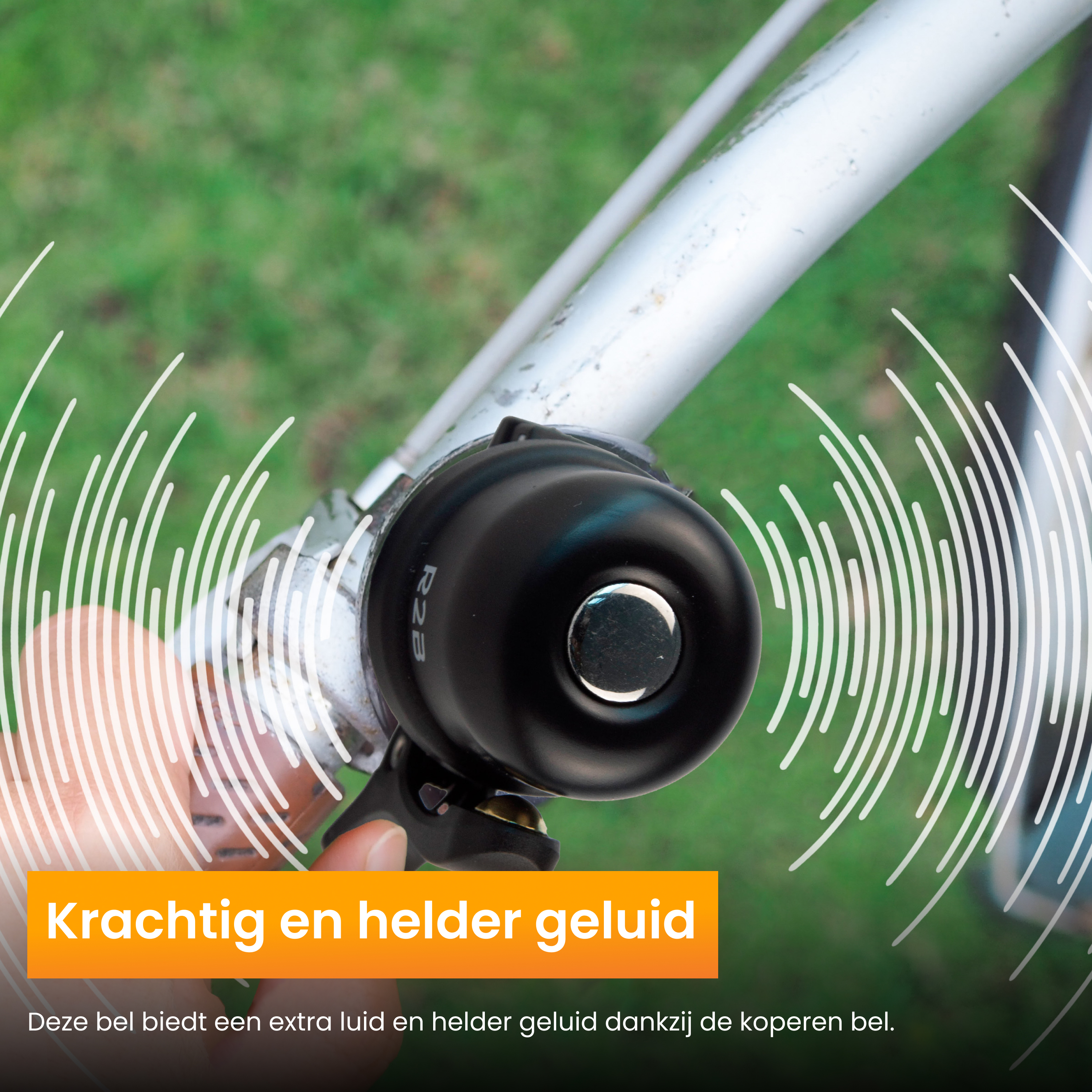 Black bicycle bell mounted on a handlebar, with sound wave graphics, close-up.