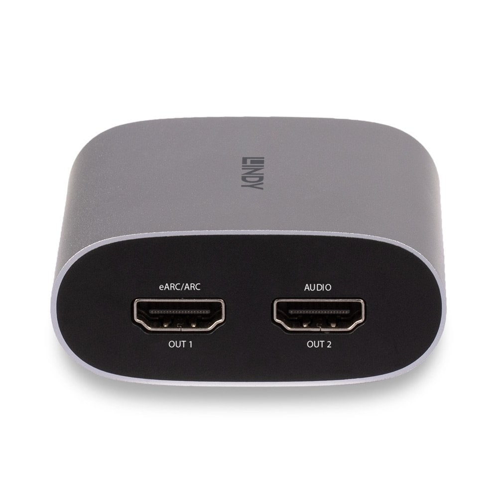 Silbernes rechteckiges Gerät mit zwei HDMI-Anschlüssen, beschriftet mit eARC/ARC und AUDIO.