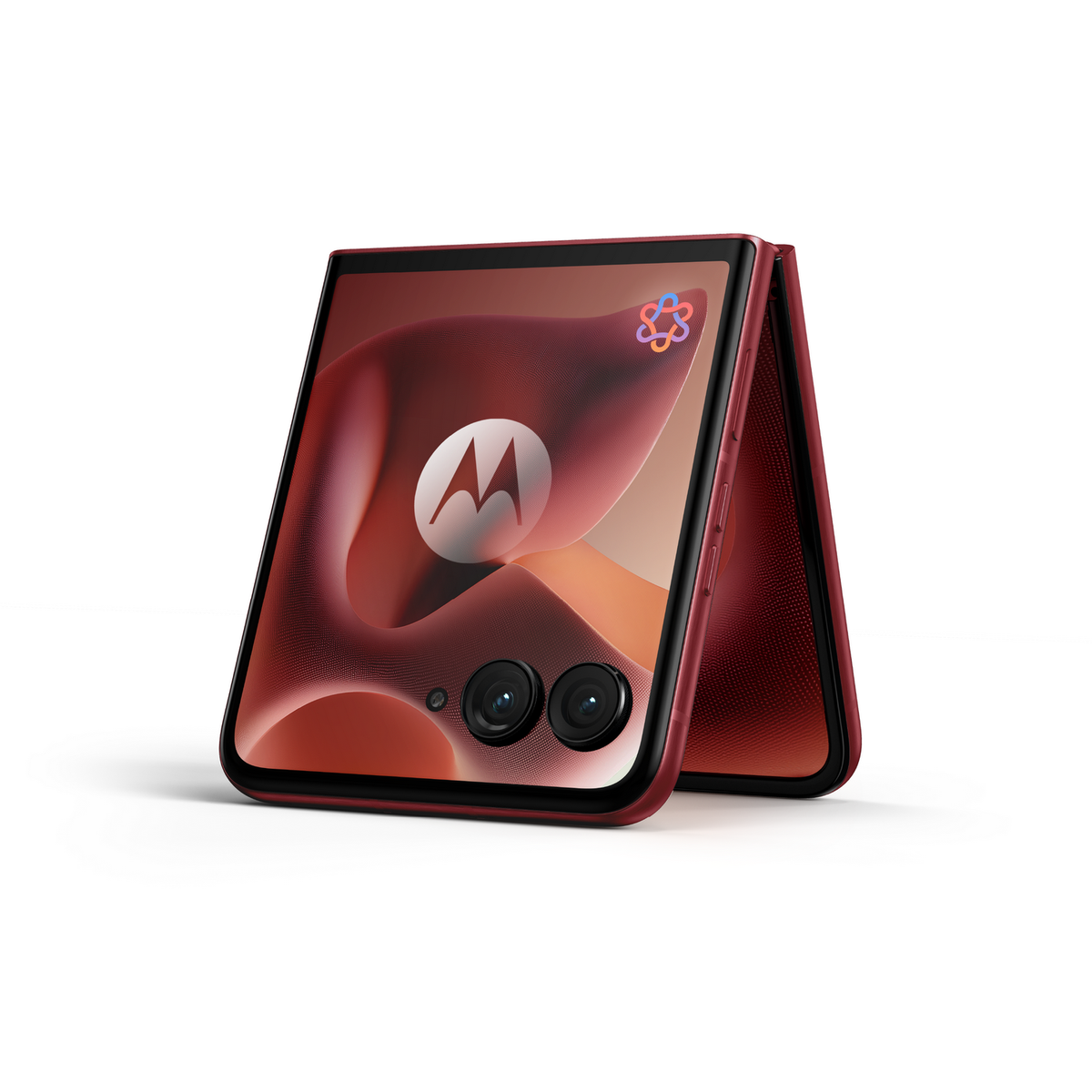 Czerwony składany telefon, otwarty, pokazujący ekran z logo i rozmytym tłem.