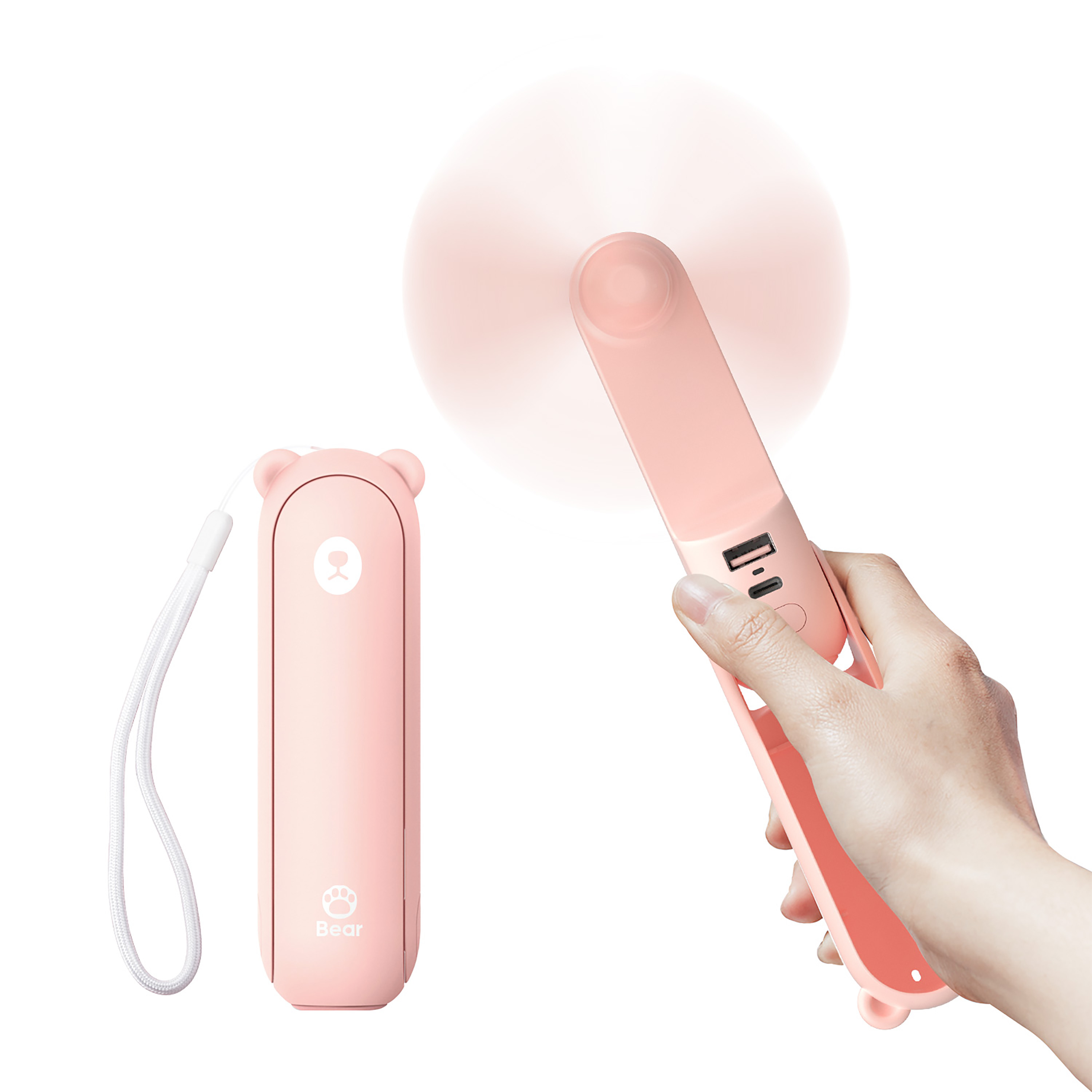 Pembe ayı tasarımlı taşınabilir fan, el ile tutuluyor. Yanında başka bir ünite var.