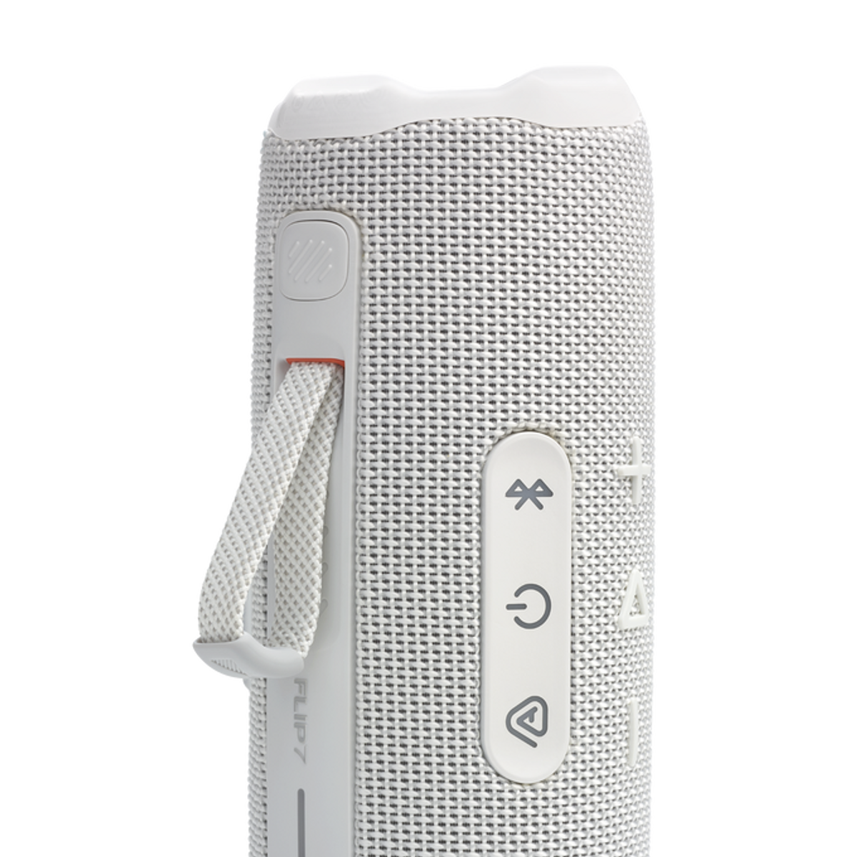 Biało-szary głośnik przenośny JBL Flip 7 na ciemnym tle.