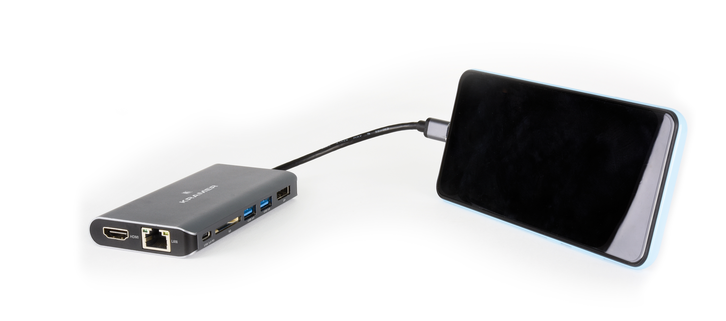 Un hub nero collegato a un telefono. Sono visibili porte HDMI, LAN e USB. Sfondo bianco.