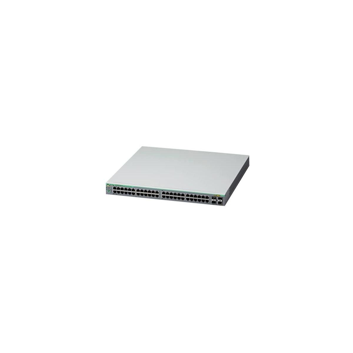 Uno switch di rete argentato con più porte e una parte superiore grigio scuro su sfondo bianco.