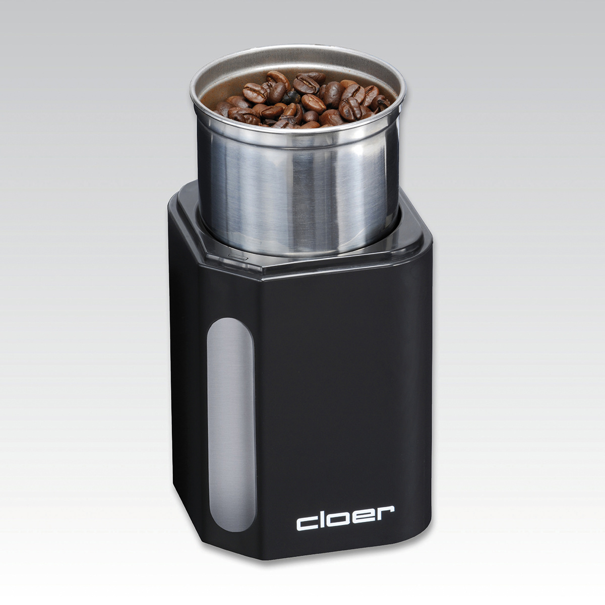 Schwarze Kaffeemühle mit Bohnen in Edelstahlbehälter. Weißer Hintergrund.