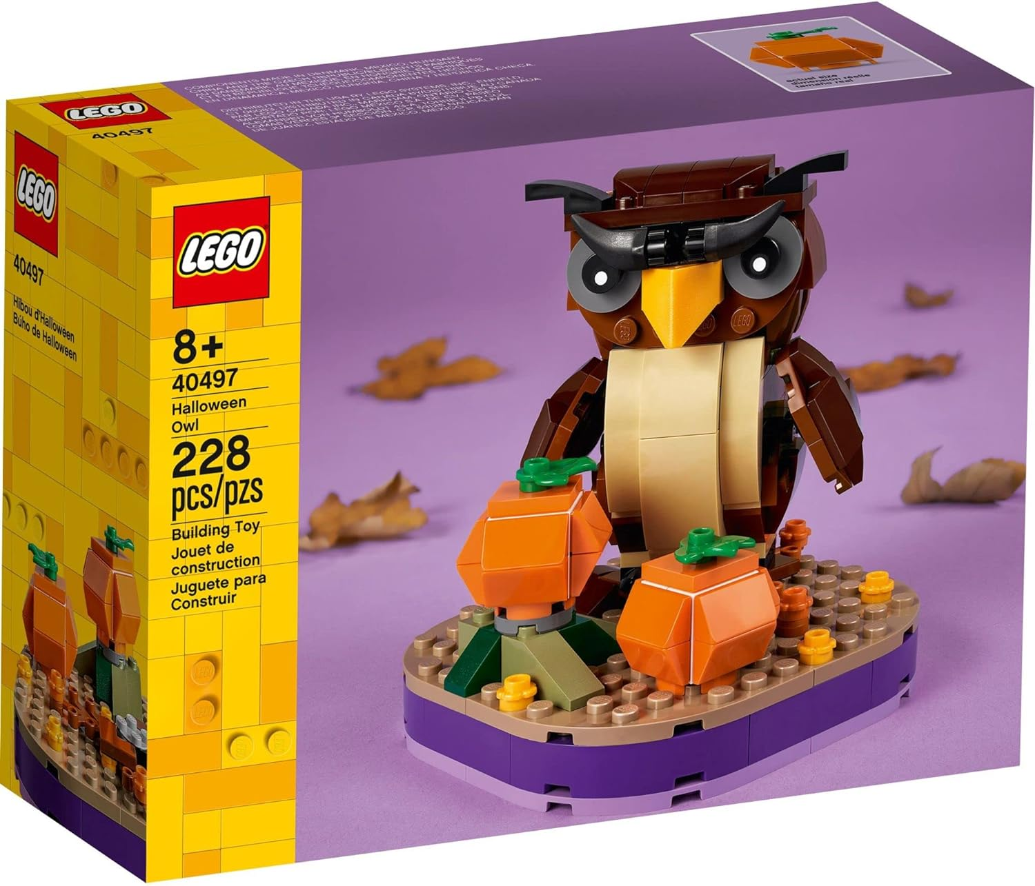 Un set LEGO di Halloween con un gufo e zucche, con una scatola che mostra la costruzione.