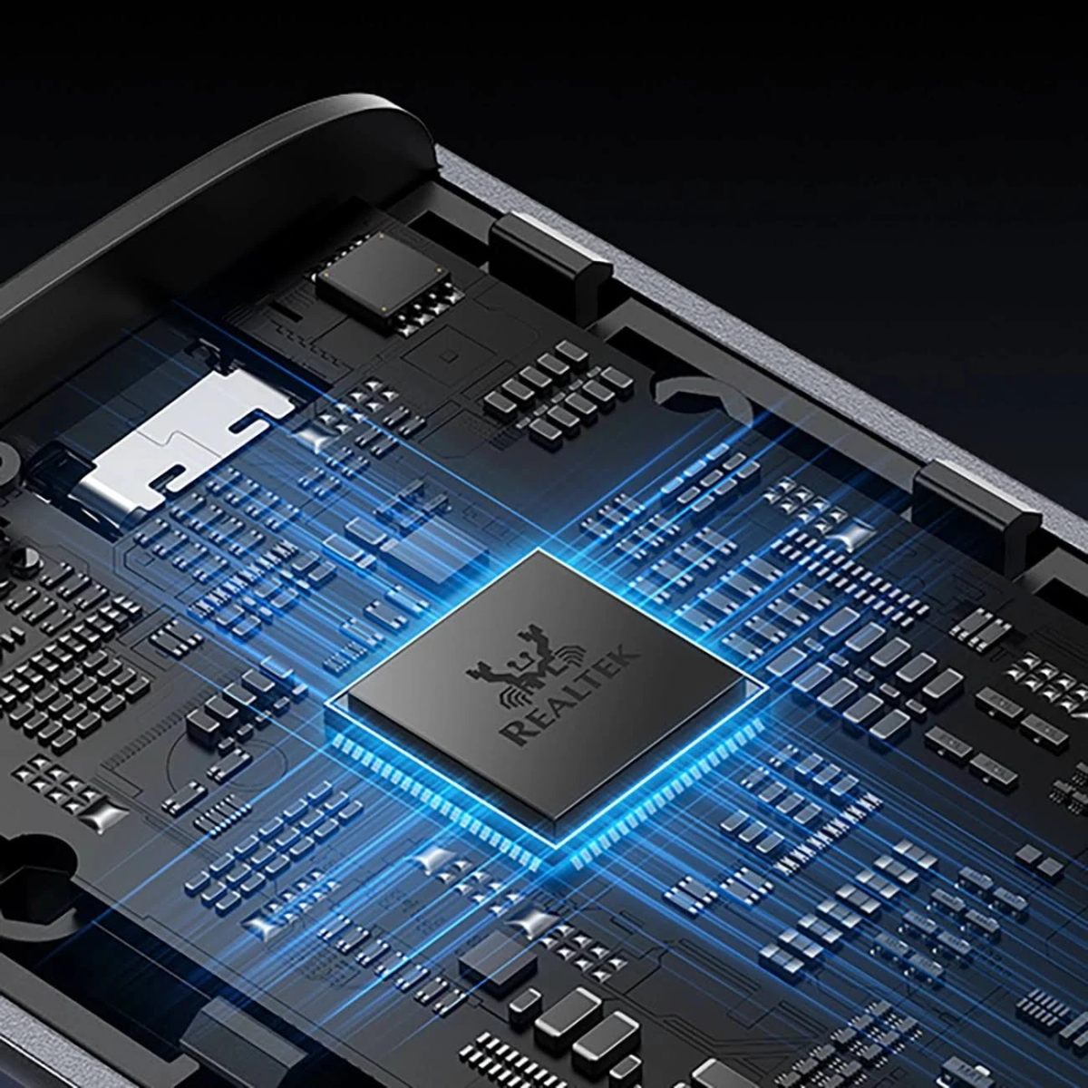 Zbliżenie czarnej płytki drukowanej z niebieskimi świecącymi liniami i chipem 'REALTEK' pośrodku.