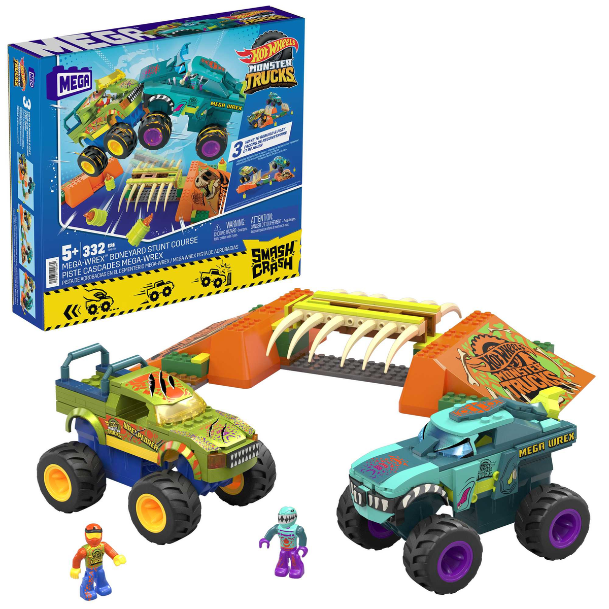 Pudełko z zestawem Hot Wheels Monster Truck i monster truckami, elementami toru i figurkami.