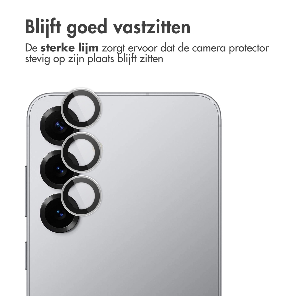 Téléphone avec protections d'appareil photo, trois cercles noirs avec des centres clairs. Le téléphone est argenté.
