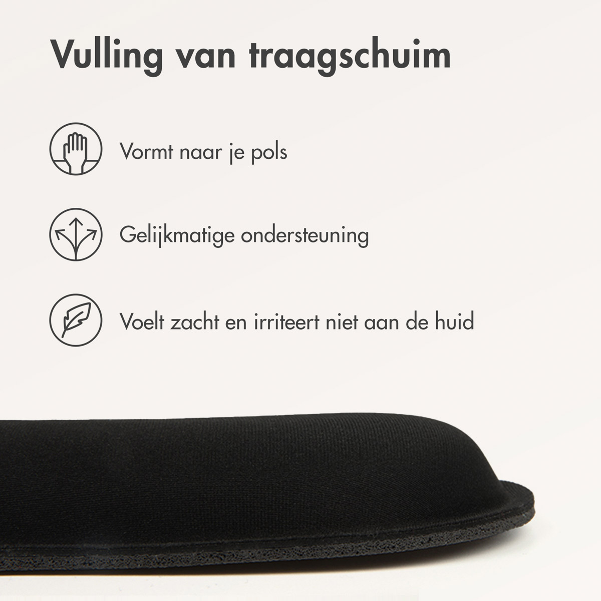 A black wrist rest with a memory foam filling. It's on a white surface and has icons above it.