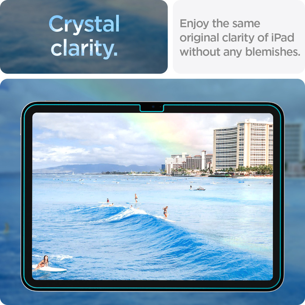 Une tablette avec un protecteur d'écran appliqué. Une scène de plage avec un arc-en-ciel est visible sur l'écran.