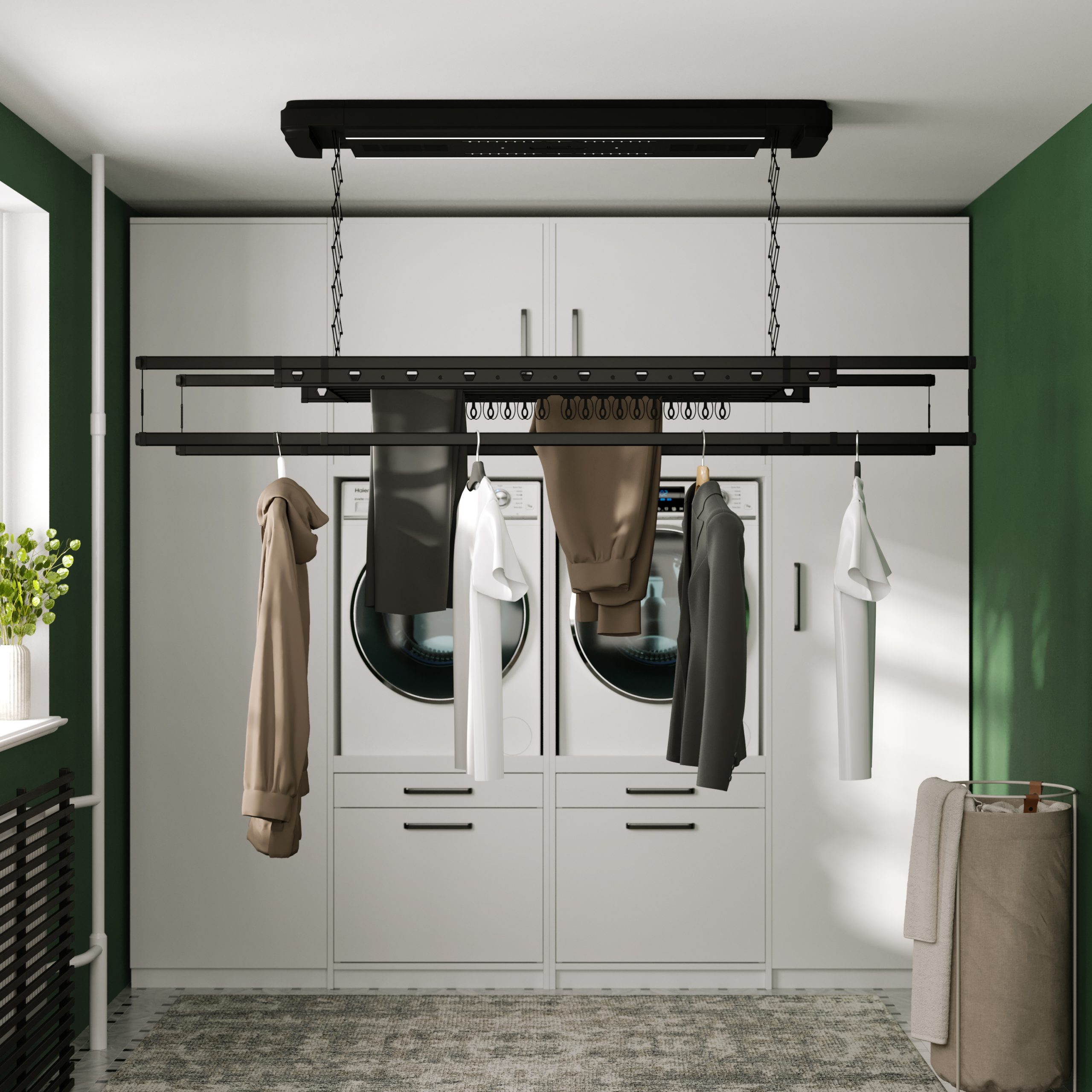 Een wasruimte met een droogrek en hangende kleding. De kamer heeft een moderne uitstraling.