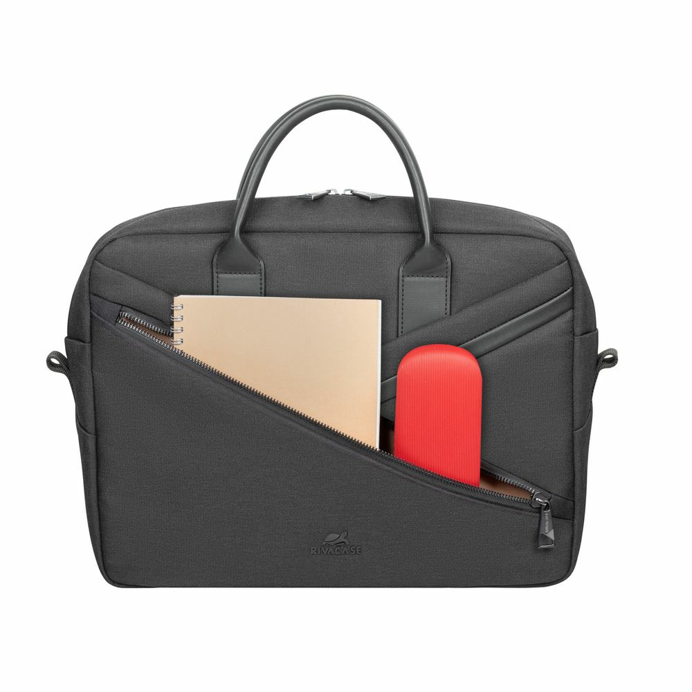 Schwarze Aktentasche mit Griff, Vordertasche und rotem Etui. Ein Notizblock ist ebenfalls sichtbar.