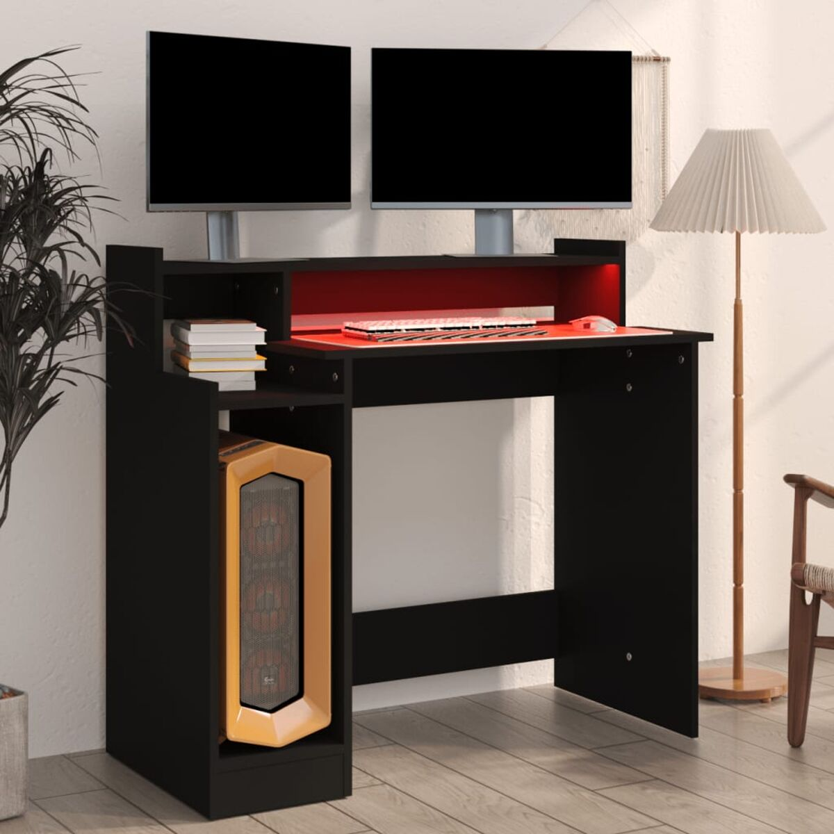 Ein schwarzer Computertisch mit zwei Monitoren.