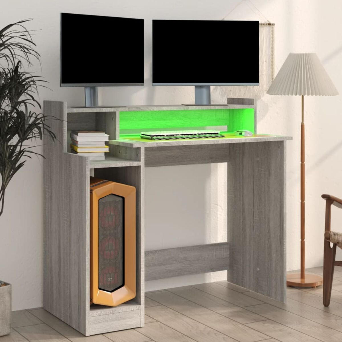 Gaming-Schreibtisch-Setup mit zwei Monitoren und einem PC-Tower, mit grüner LED-Beleuchtung.