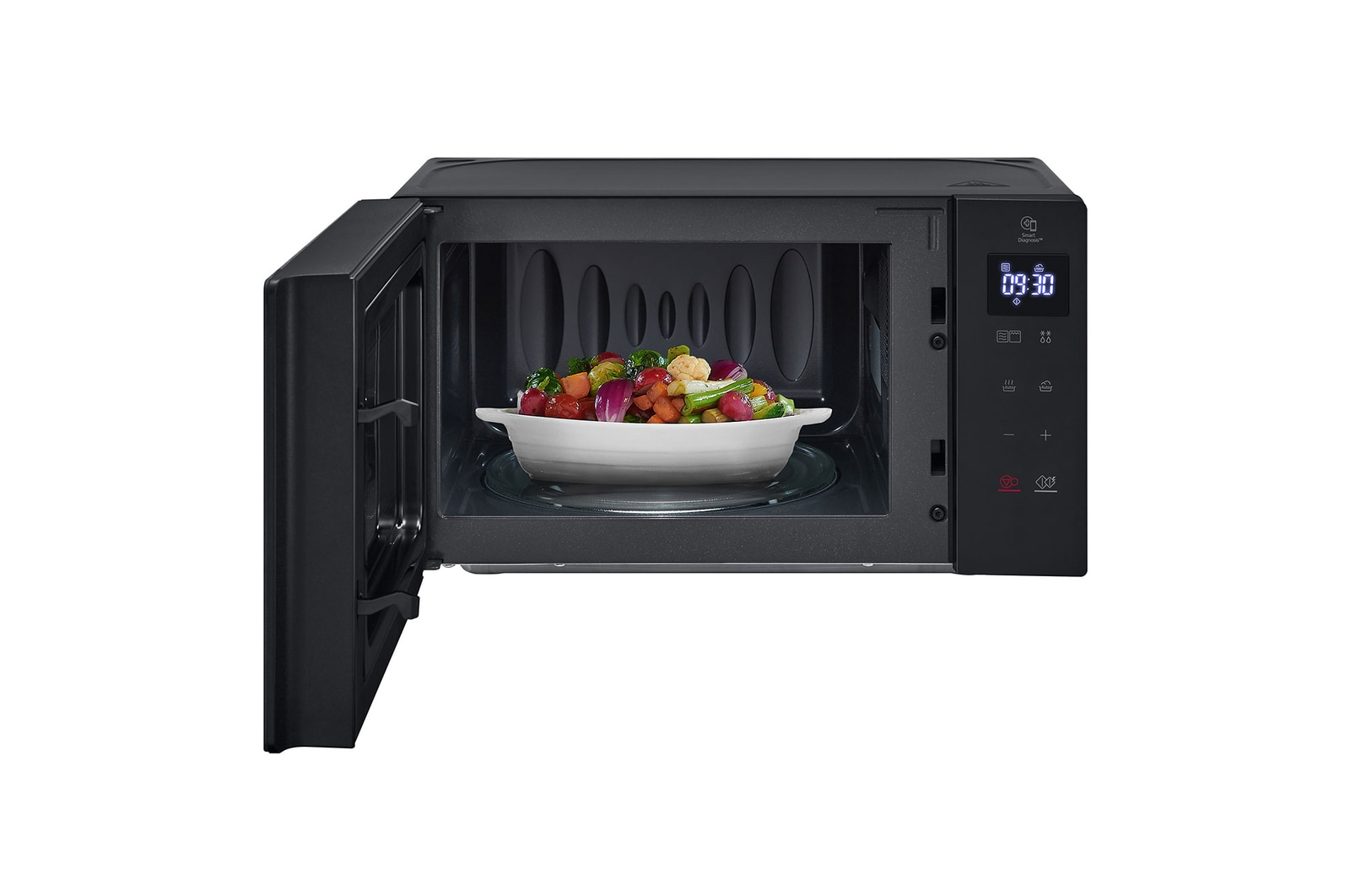 Black microwave with open door. A plate of colorful food is inside.