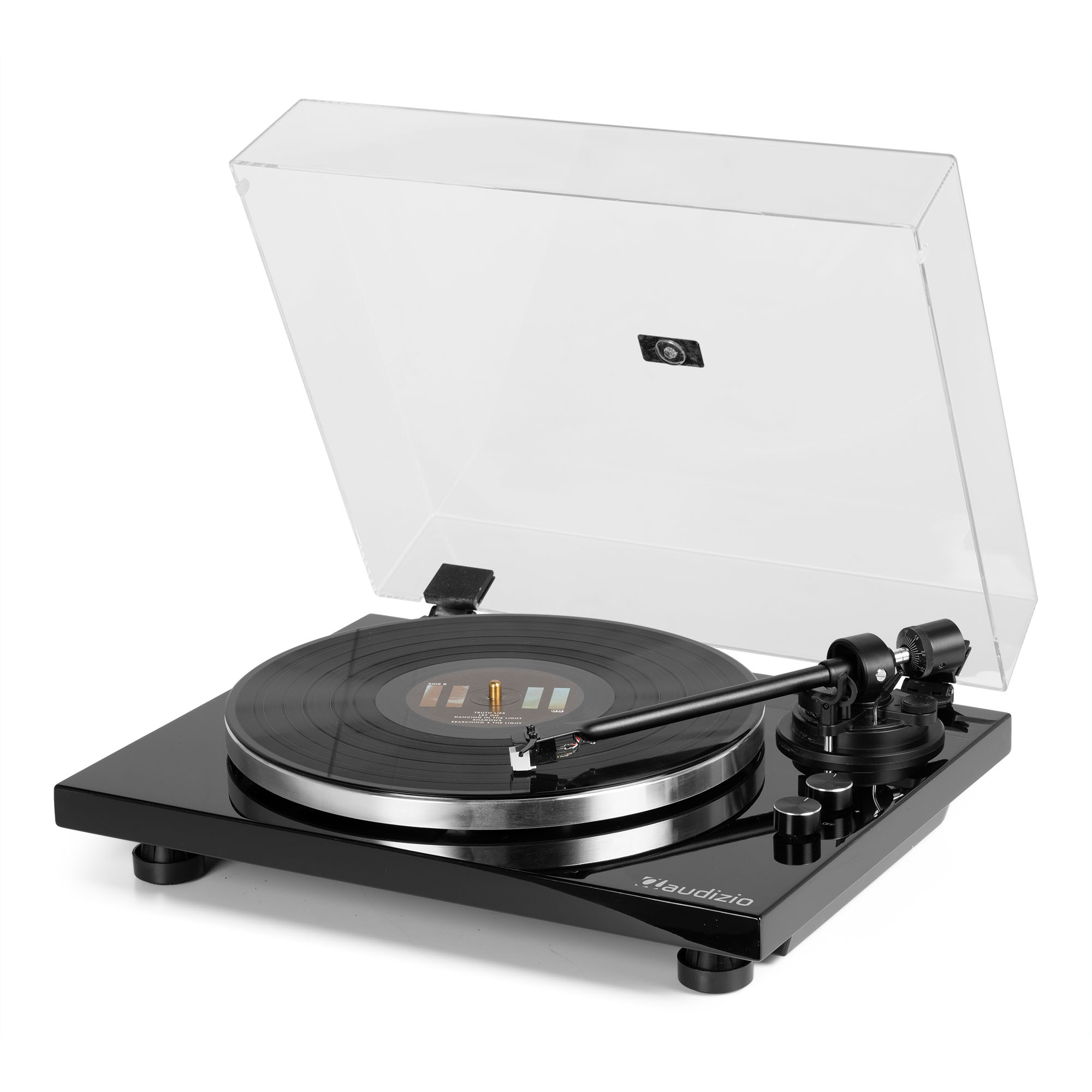 Un tocadiscos negro con la cubierta transparente abierta, mostrando un disco en su lugar.