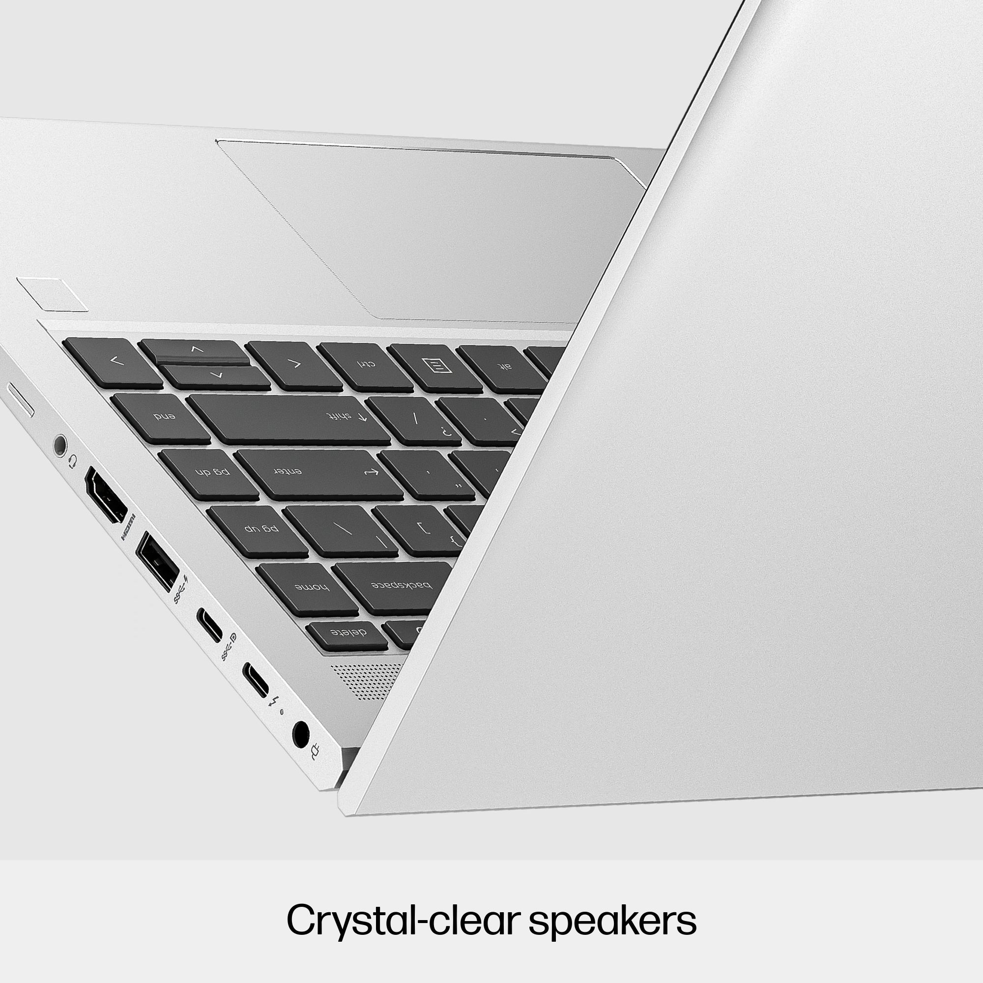 Laptop, angolato, con porte visibili. Tasti neri, corpo bianco. Porte: HDMI, USB e audio.