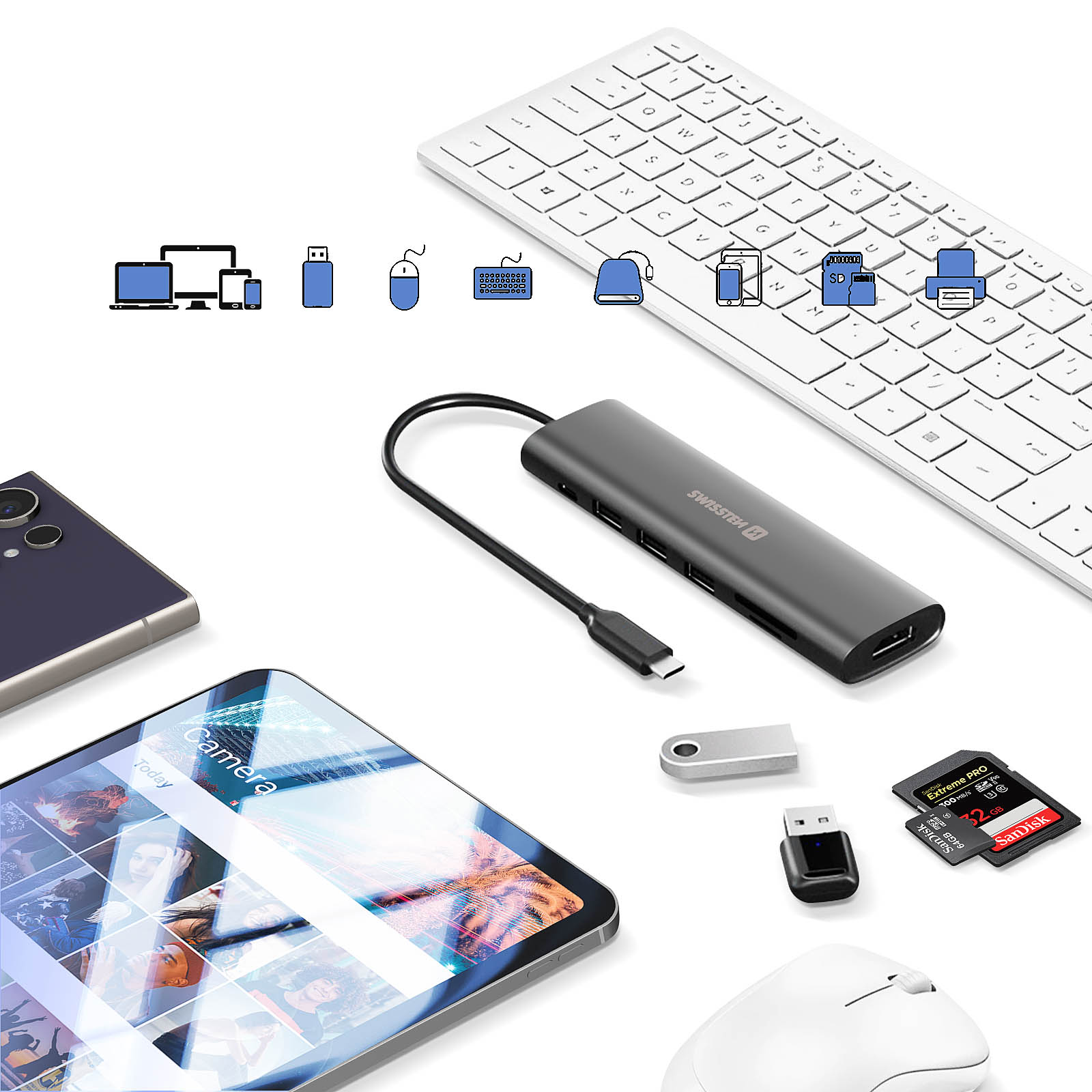 Configurazione tech con hub, tastiera, telefono e altri dispositivi. USB, SD e mouse.