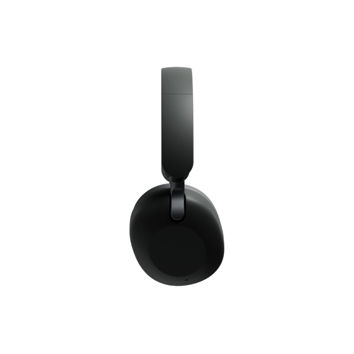 Casque audio supra-auriculaire noir au design épuré, suspendu sur fond blanc.