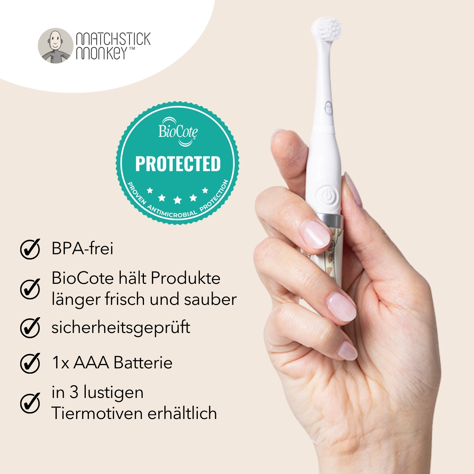 Die Hand einer Frau hält eine weiße elektrische Zahnbürste. Die Verpackung hat ein Siegel und Text.