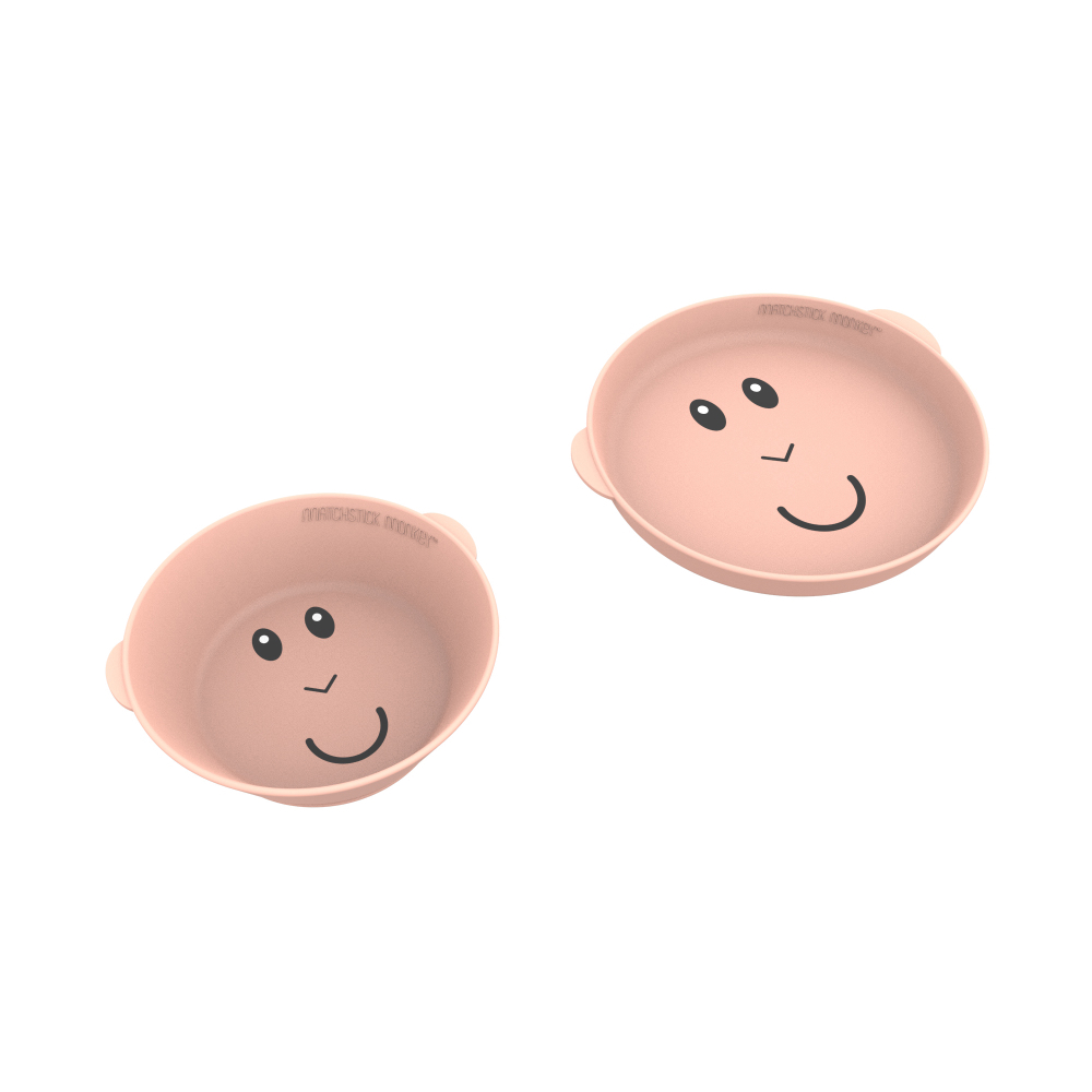 Zwei rosa Baby-Essschalen mit lächelnden Gesichtern. Matchstick Monkey Markenname.