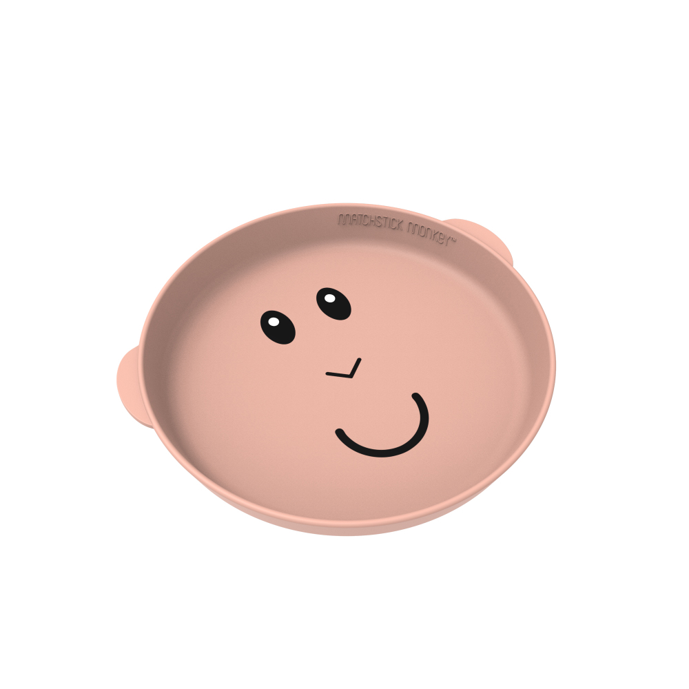 Eine rosa Schüssel mit einem lächelnden Gesichtsdesign.