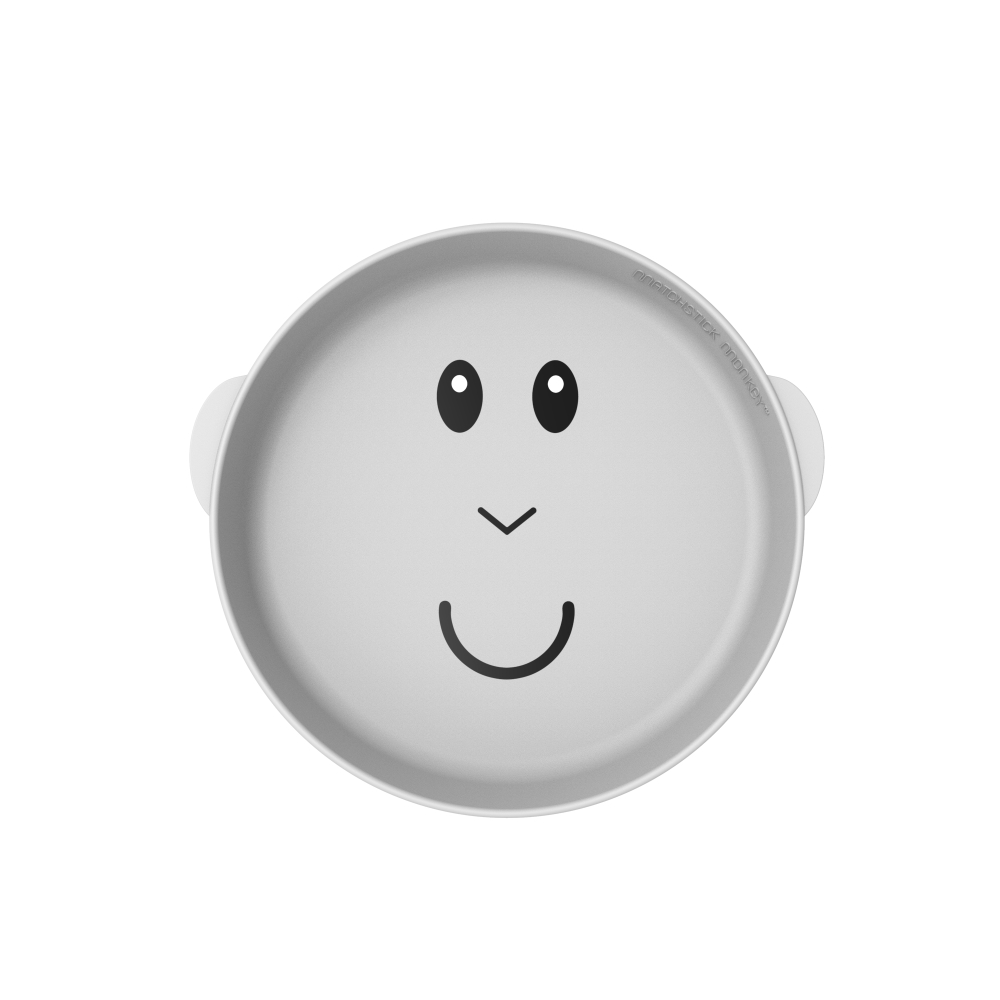 Eine graue Babyschüssel mit einem gezeichneten Cartoon-Smiley-Gesicht.
