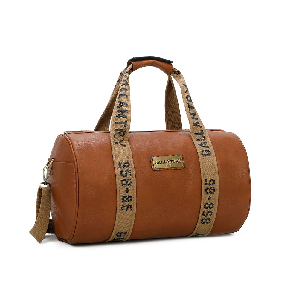 Braune Reisetasche mit braunen Riemen mit 'GALLANTRY' und '858-85' auf den Riemen.