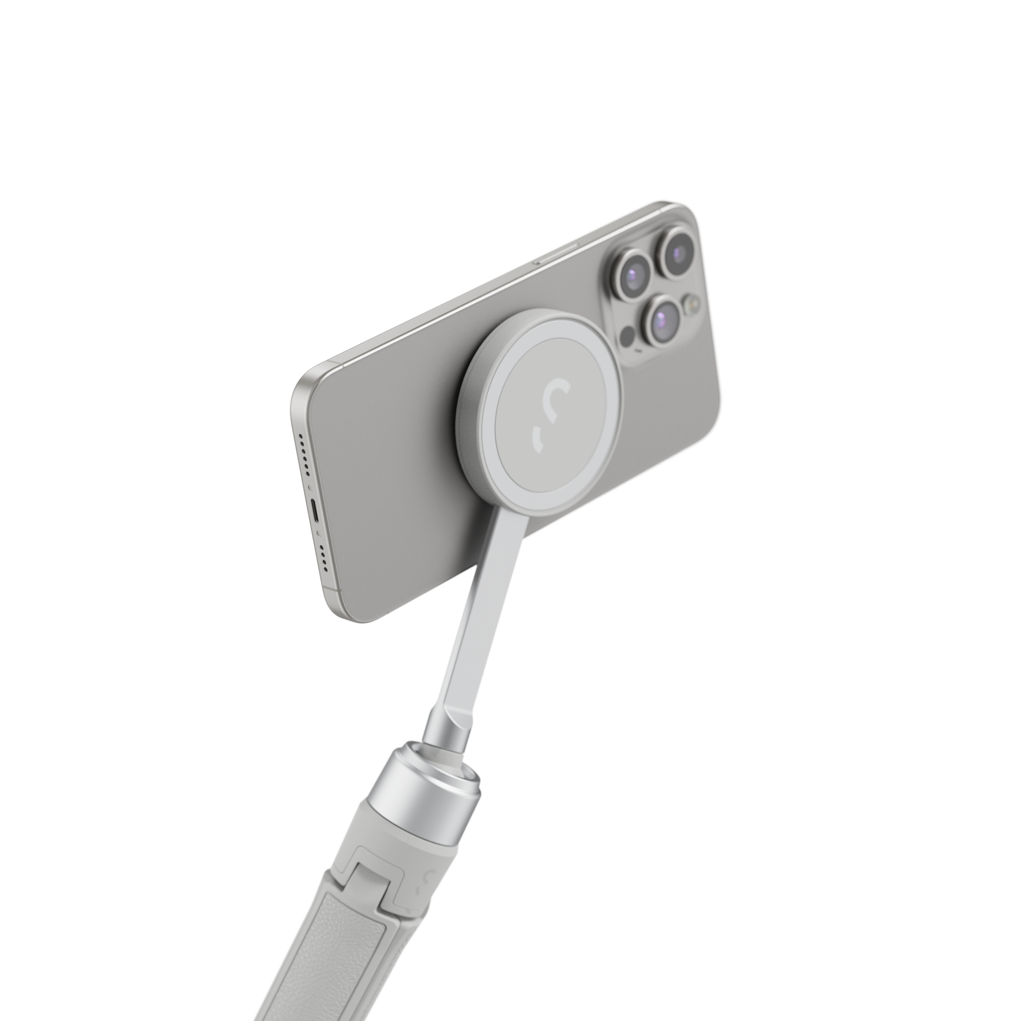 Gümüş bir iPhone, yukarı doğru açılan gümüş bir selfie çubuğuna takılı.