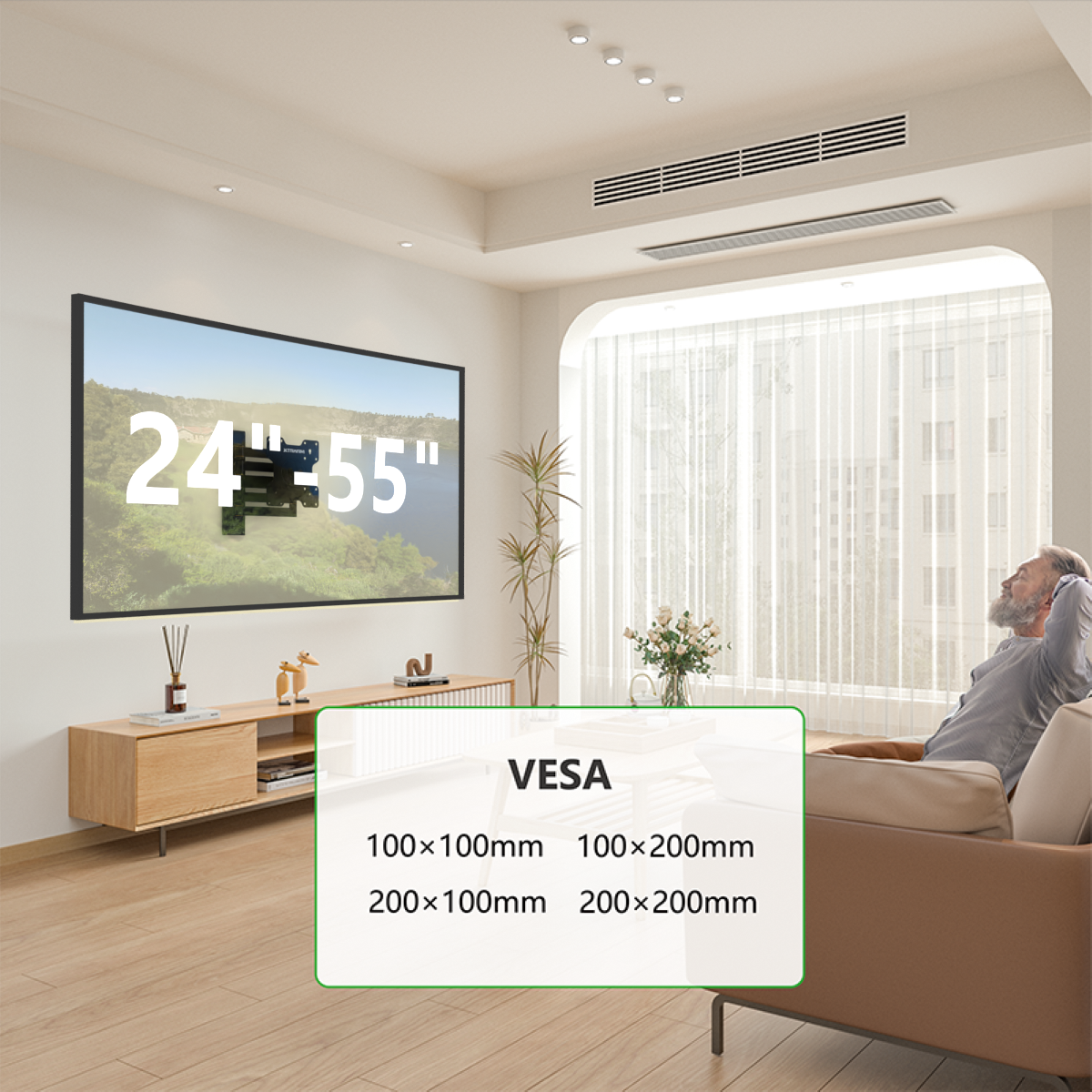 Wohnzimmer mit an der Wand montiertem Fernseher, Sofa und Mann. VESA-Größen werden angezeigt.