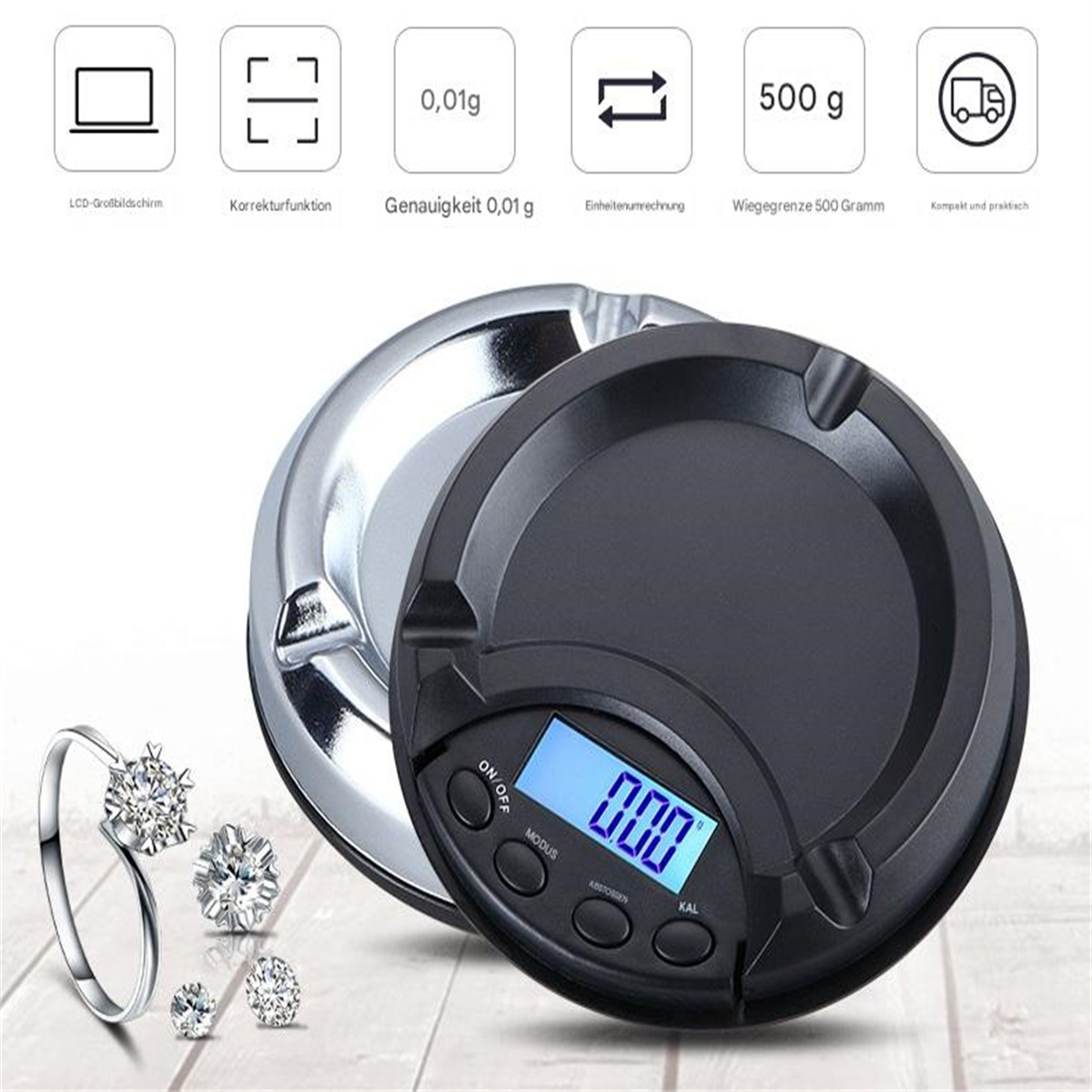 Schwarze Digitalwaage mit silberner Basis, einem Ring und Diamanten. Der Hintergrund ist weiß.
