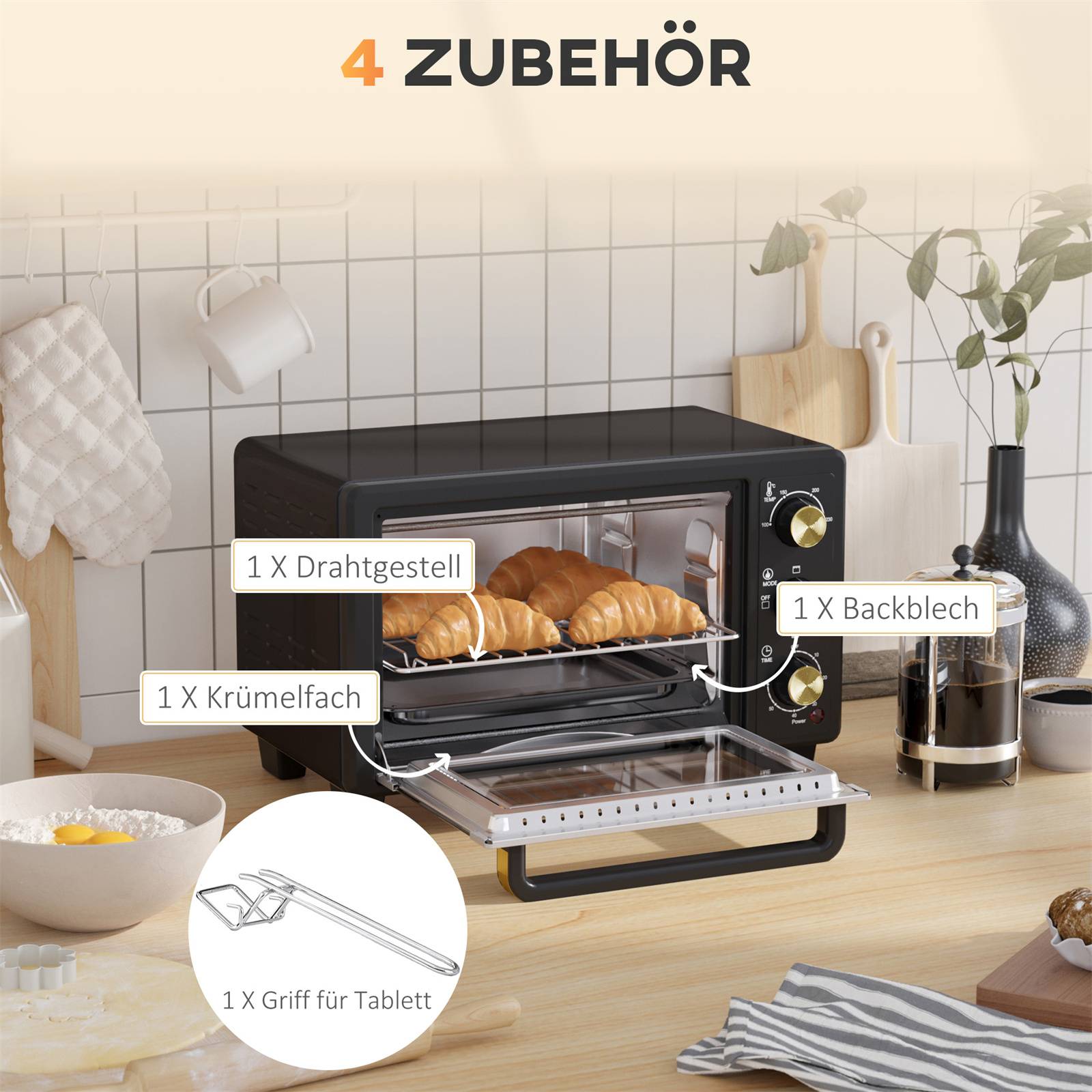 Ein Ofen mit Zubehör, darunter ein Backblech und eine Gabel, mit Croissants.