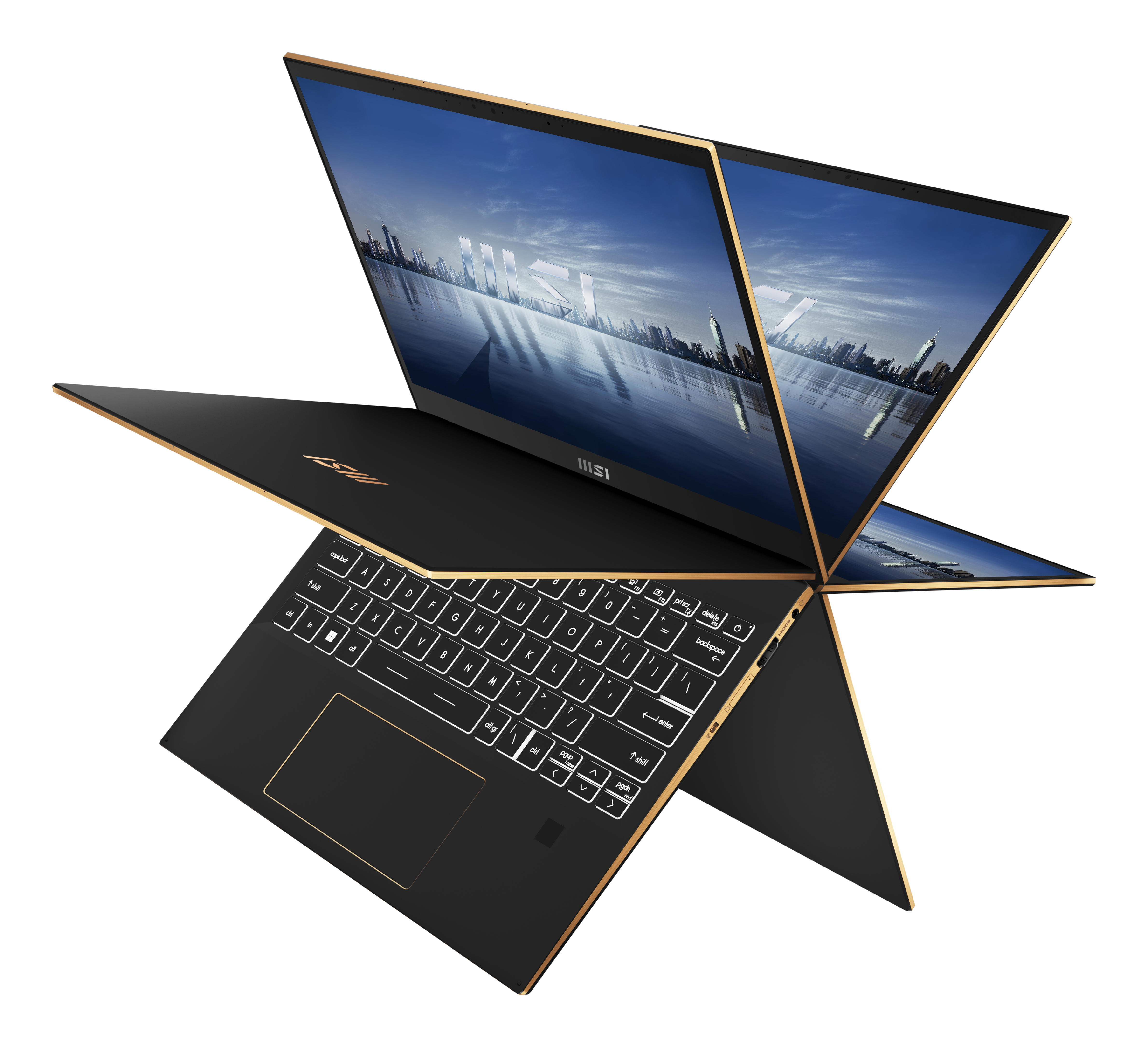 Portátil negro con ribete dorado, abierto en ángulo de 360 grados. Teclado visible, pantalla muestra ciudad.