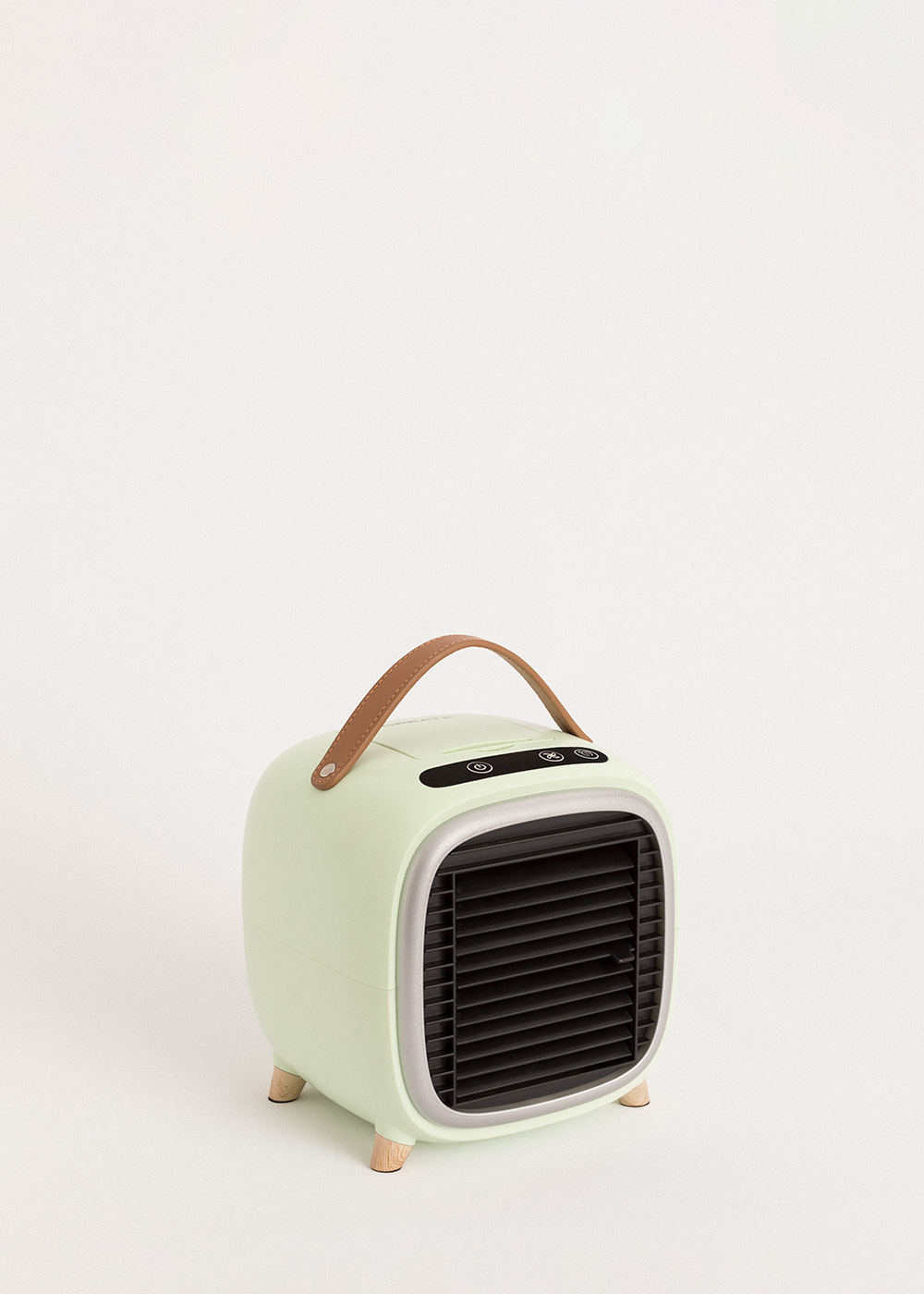 Enfriador de aire portátil verde menta con asa y patas de madera.
