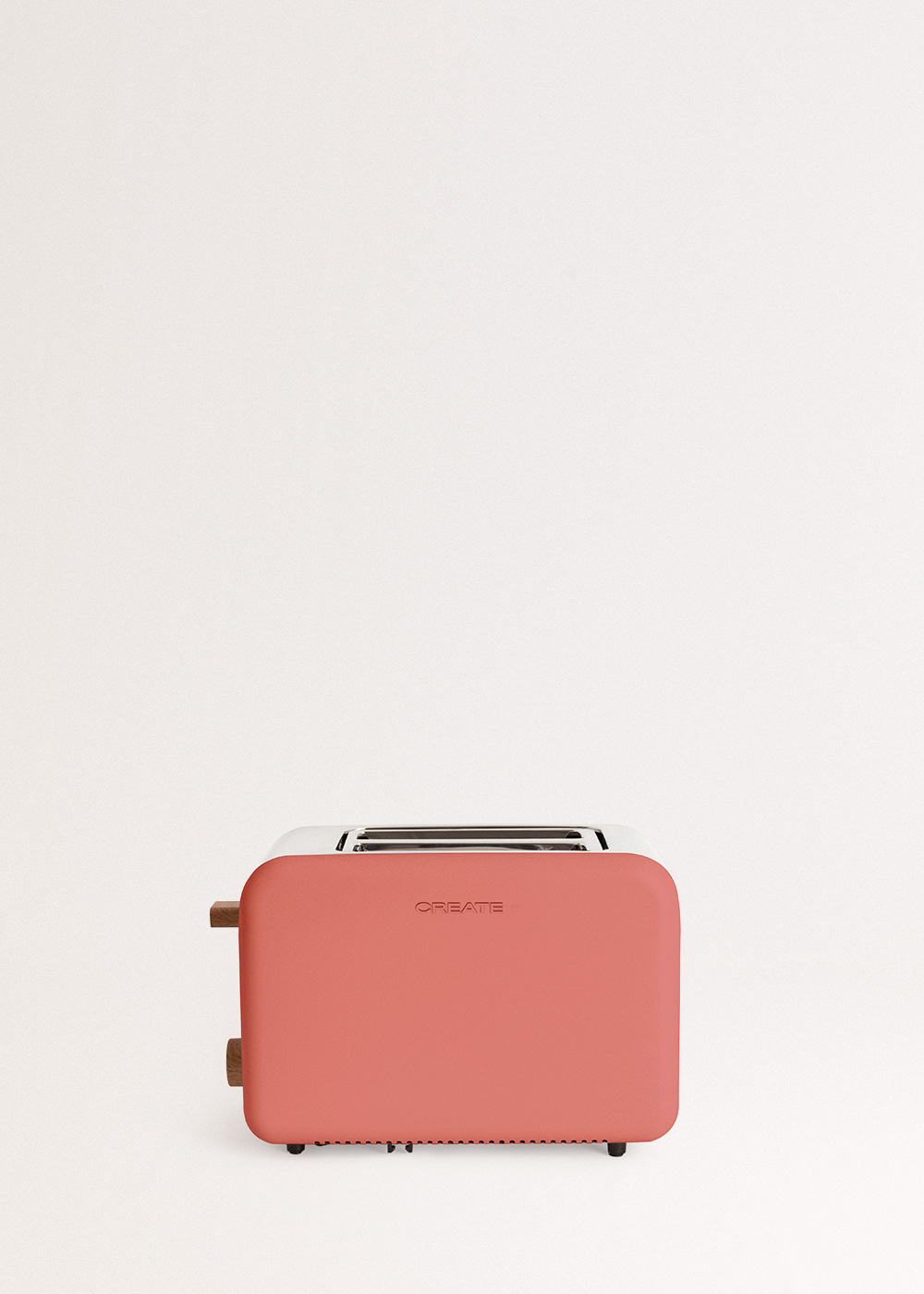 Tostadora color coral con detalles de madera, fondo blanco, diseño simple.