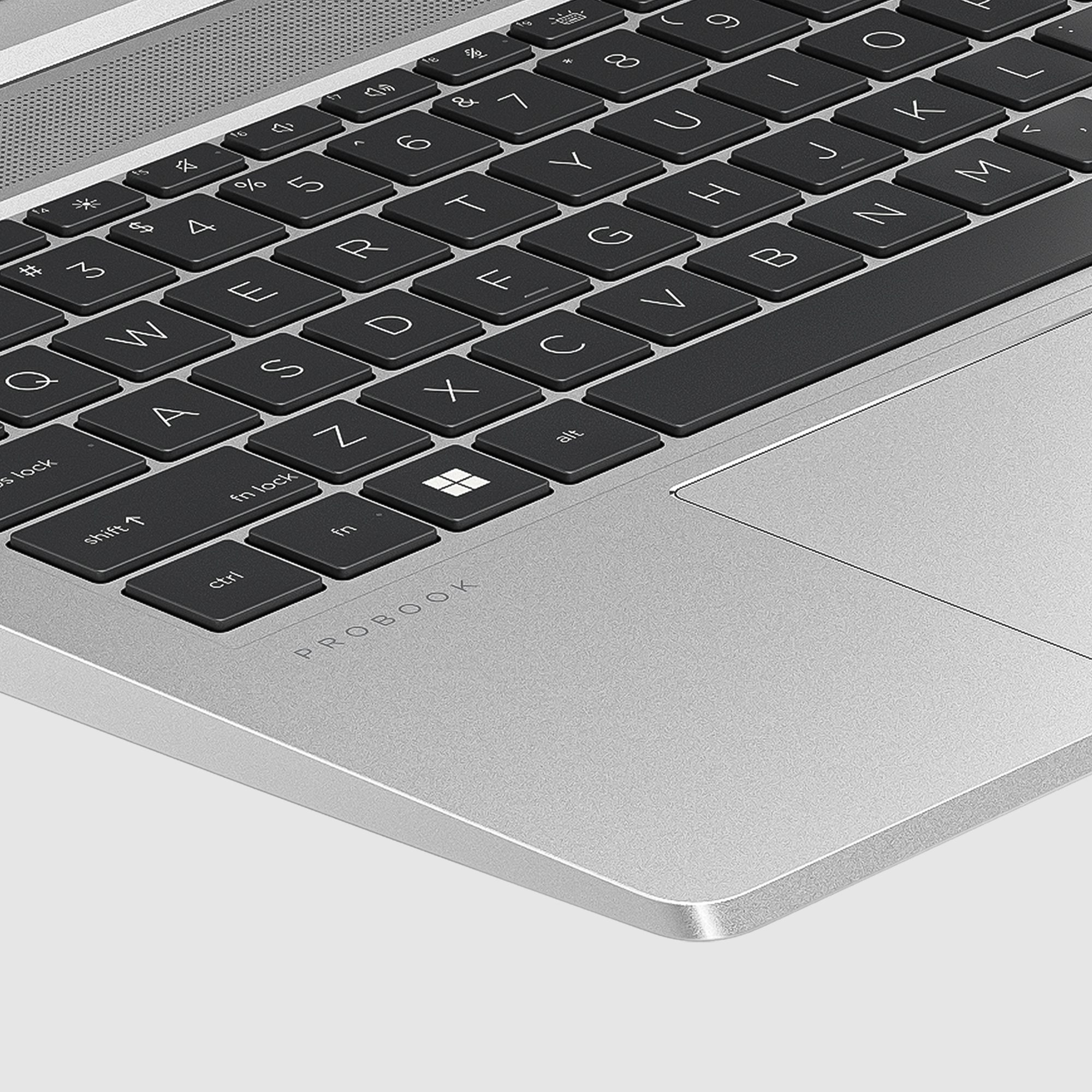Zbliżenie klawiatury i touchpada laptopa. Widoczne słowo PROBOOK.
