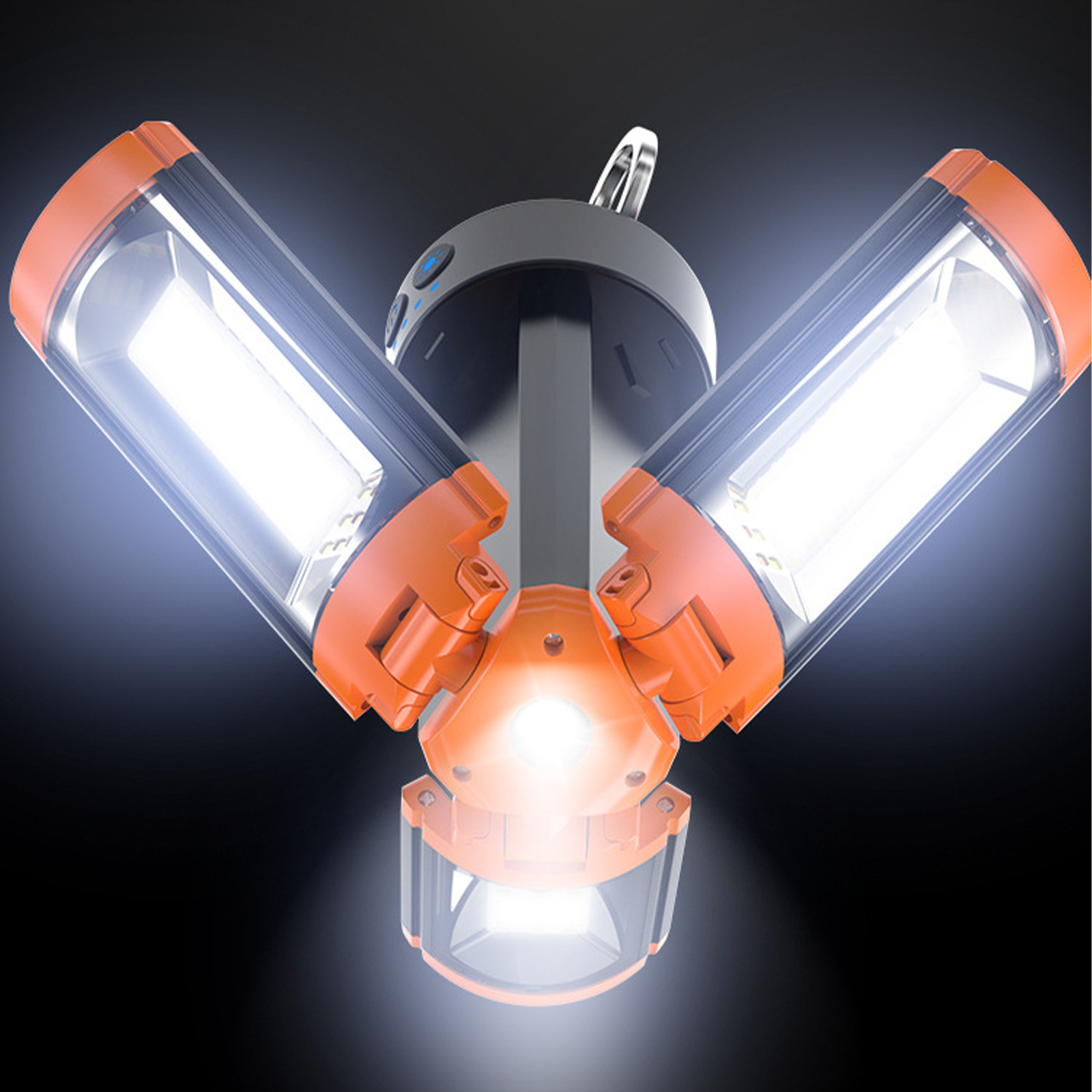 Dreiköpfiges helles Licht auf schwarzem Hintergrund. Orange und grau mit weißen Lichtern.