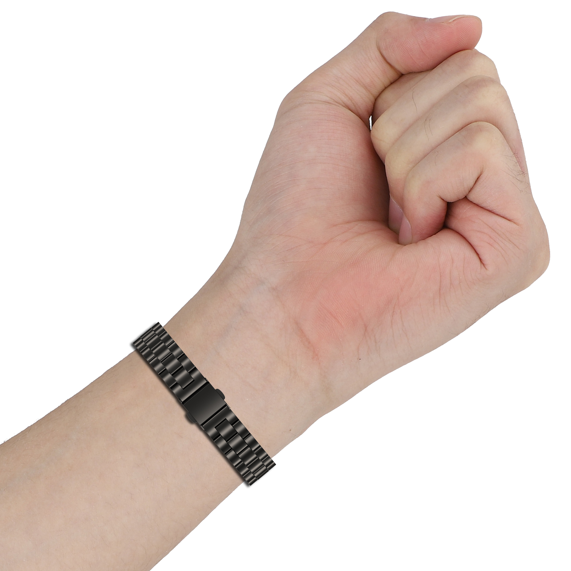 Schwarzes Uhrenarmband am Handgelenk. Das Band ist metallisch und hat einen Verschluss.
